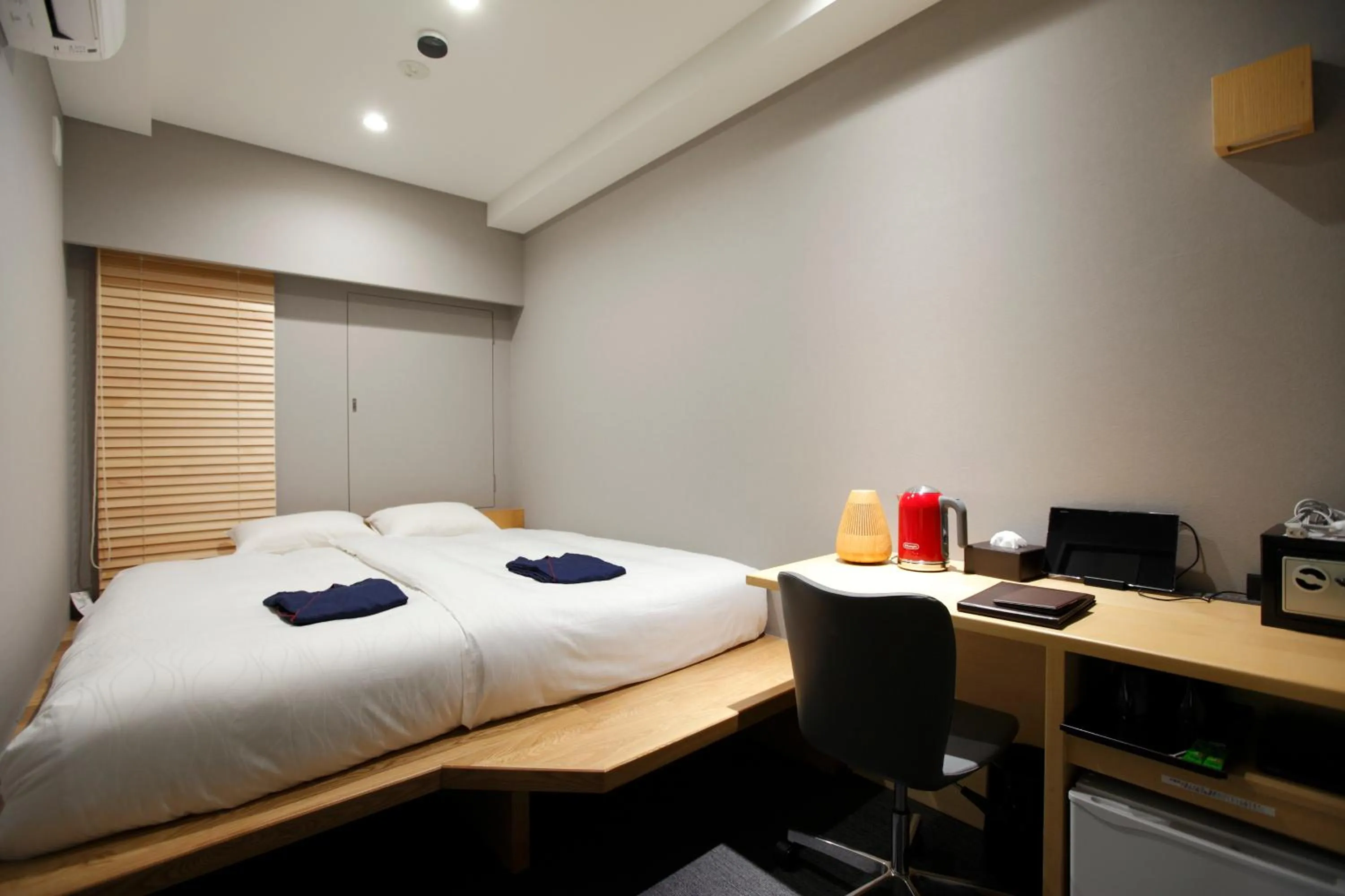Photo of the whole room, Bed in HOTEL AMANEK Ginza East