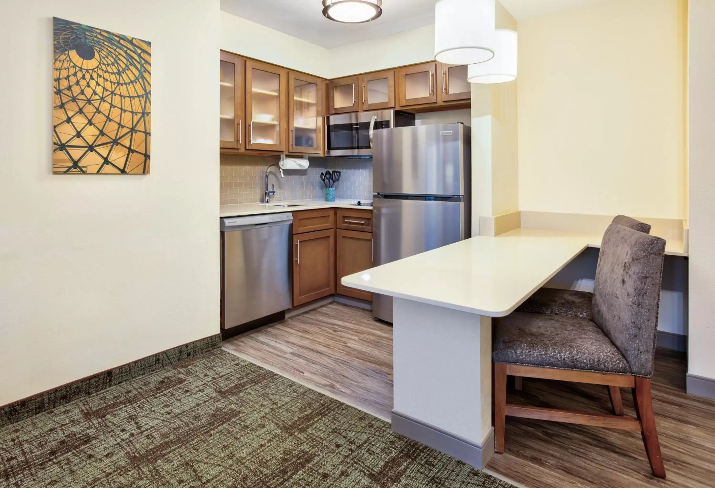 Bedroom, Kitchen/Kitchenette in Staybridge Suites Corning, an IHG Hotel