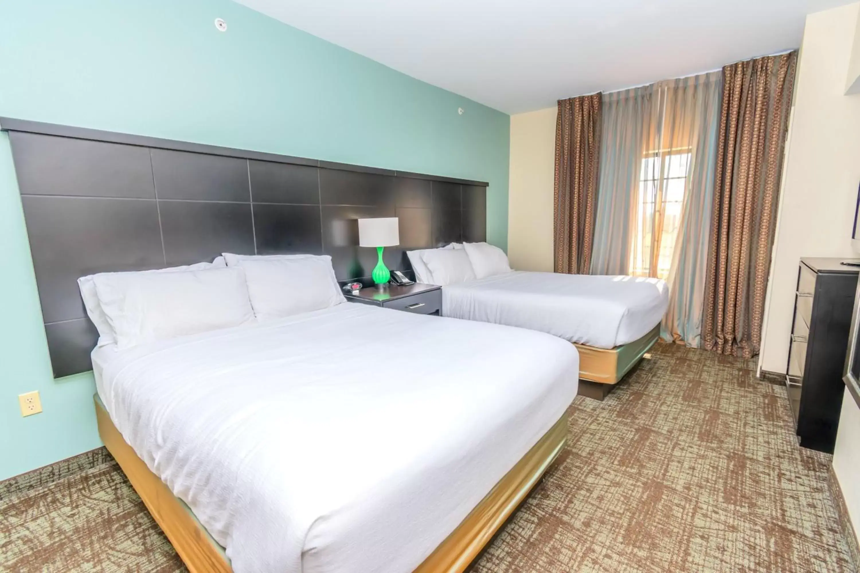 Photo of the whole room, Bed in Staybridge Suites Houston - IAH Airport, an IHG Hotel