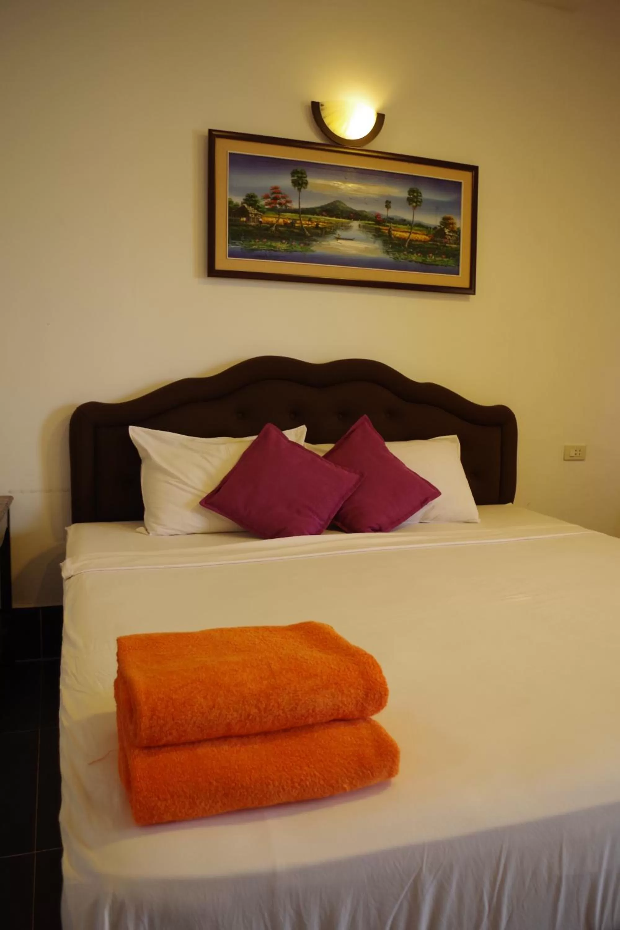 Bed in Apex Koh Kong Hotel