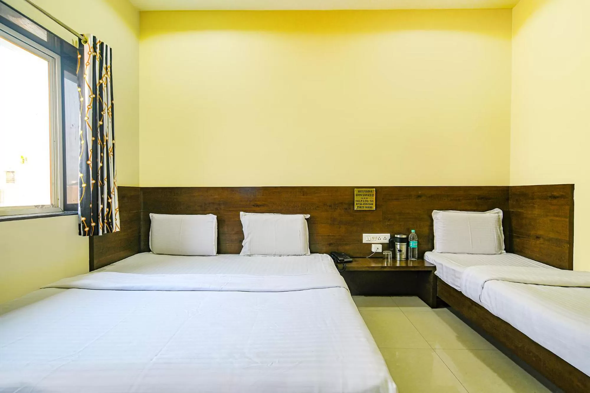 Bed in FabHotel Satyug Jaisinghpura