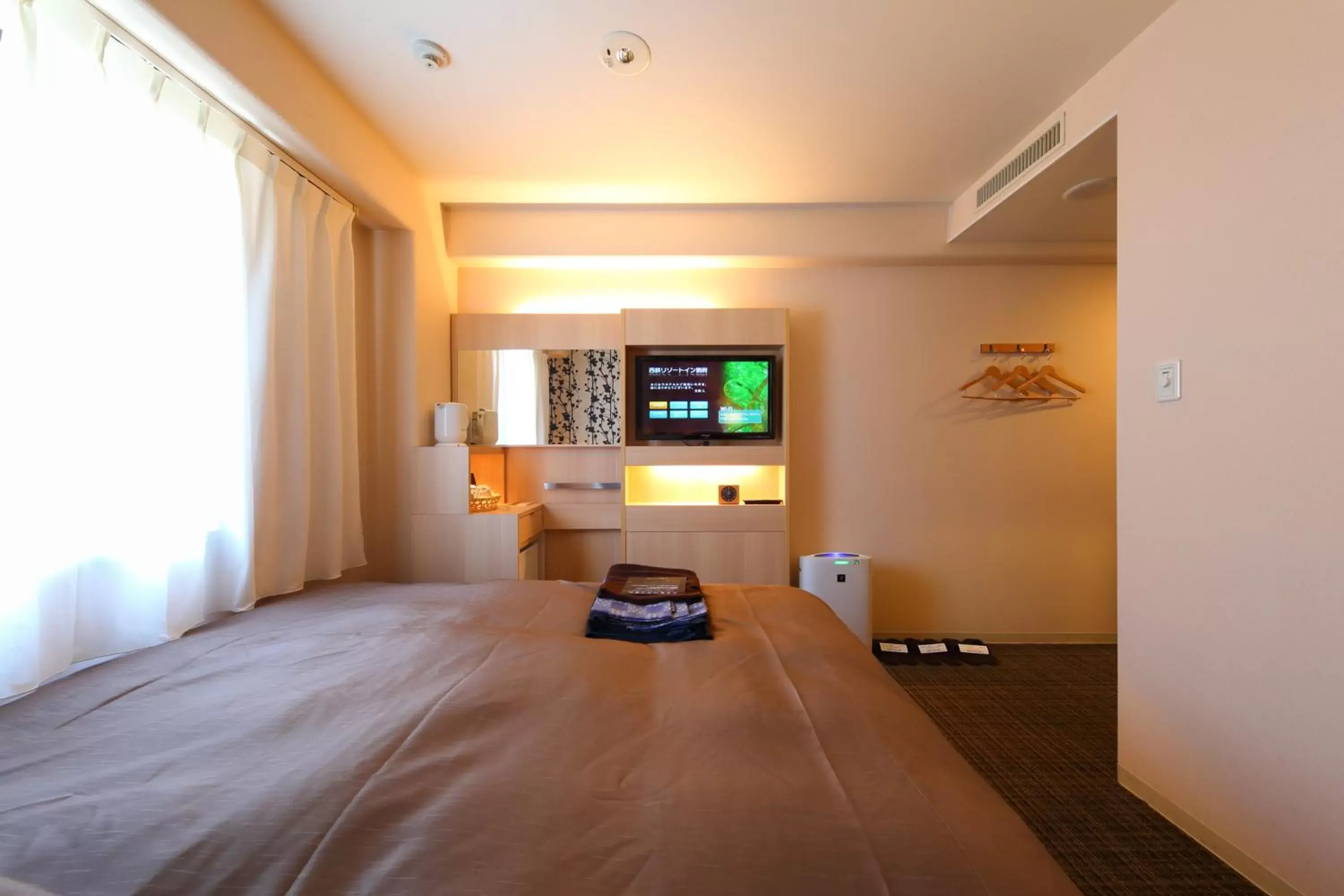 Photo of the whole room, TV/Entertainment Center in Nishitetsu Resort Inn Beppu