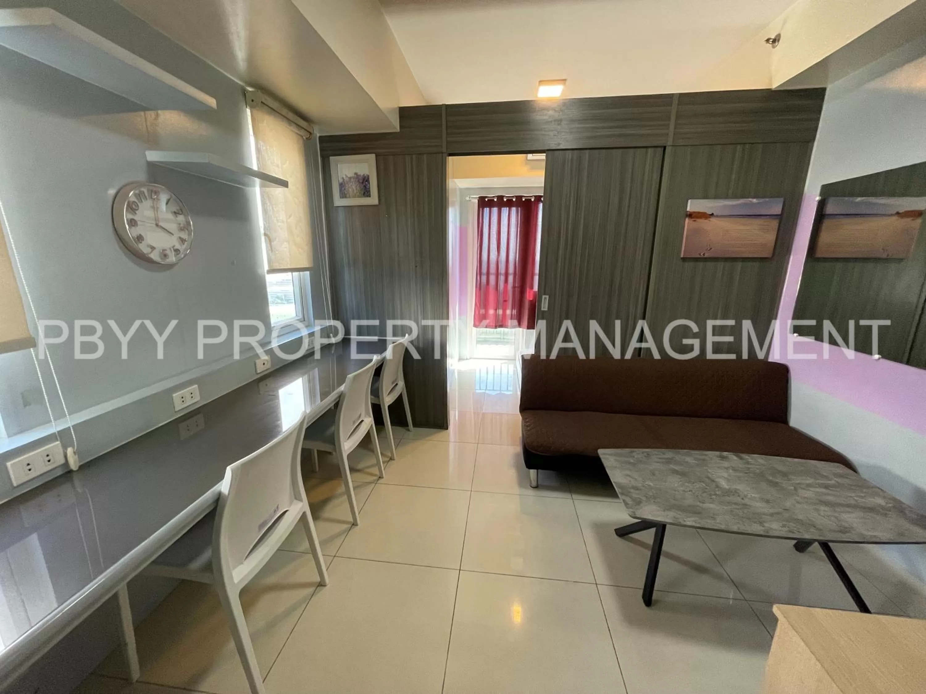 Living room in Green Residences Staycation by PBYY