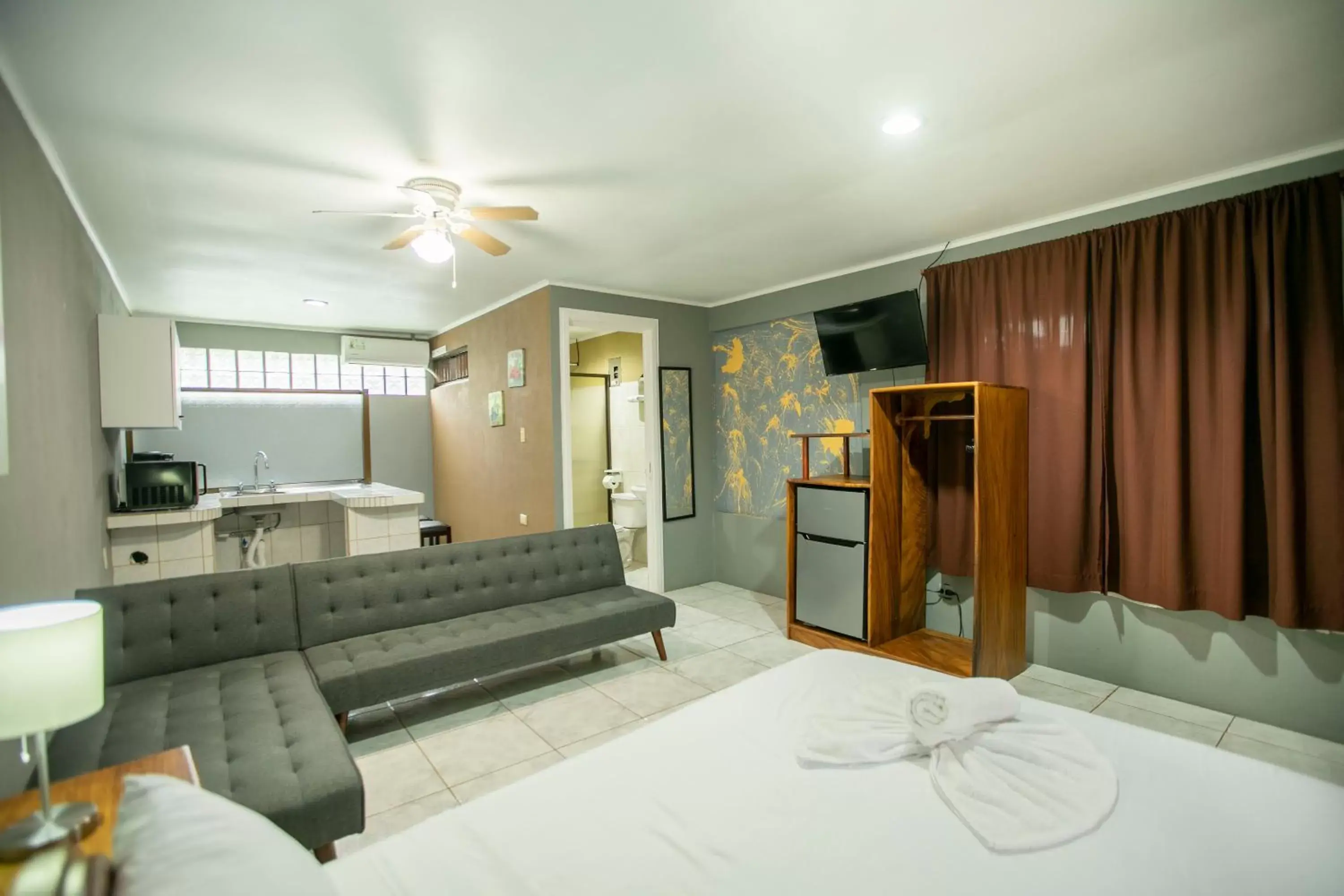 Bed, Seating Area in Coati Arenal Lodge