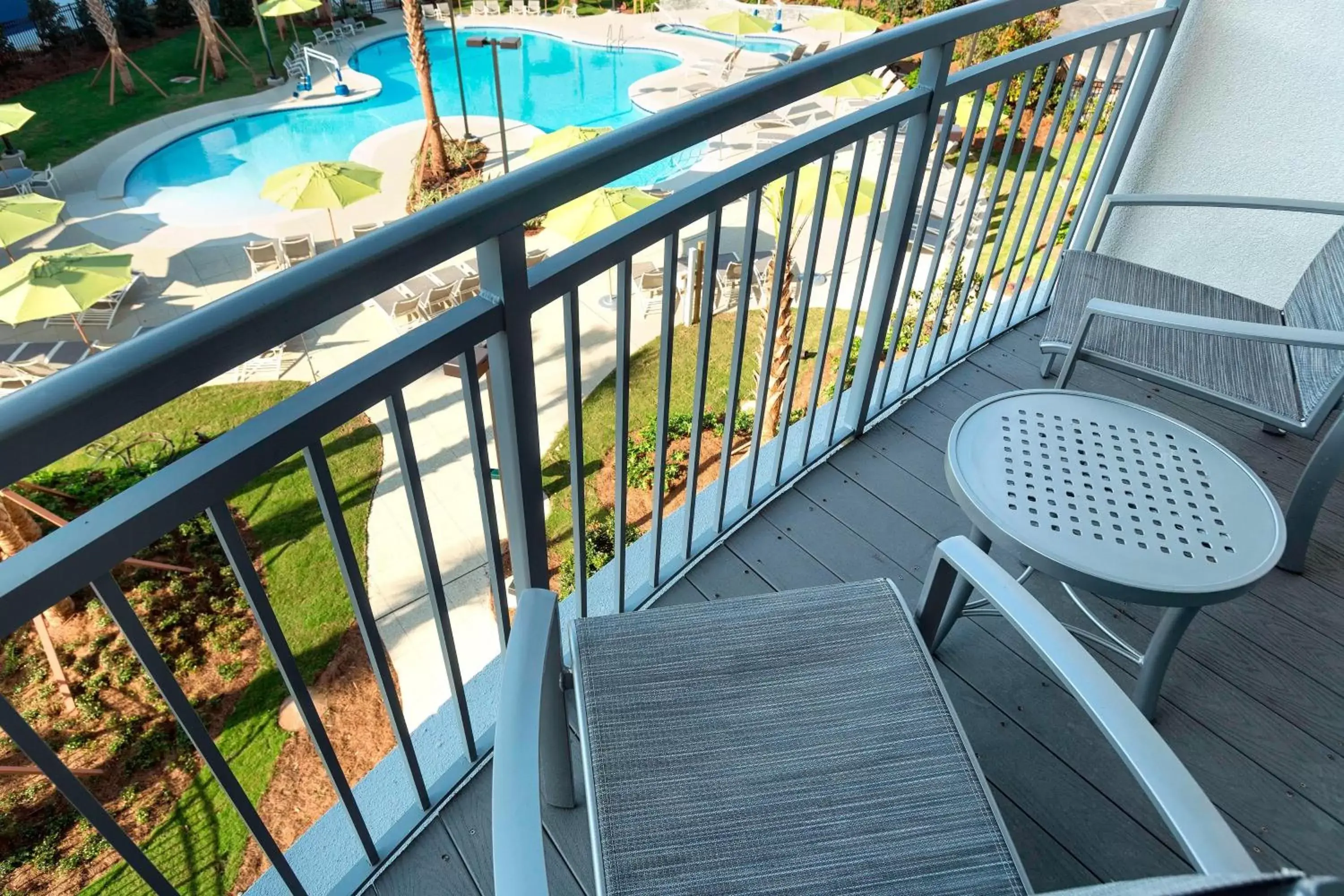 Swimming pool, Balcony/Terrace in SpringHill Suites Orange Beach at The Wharf