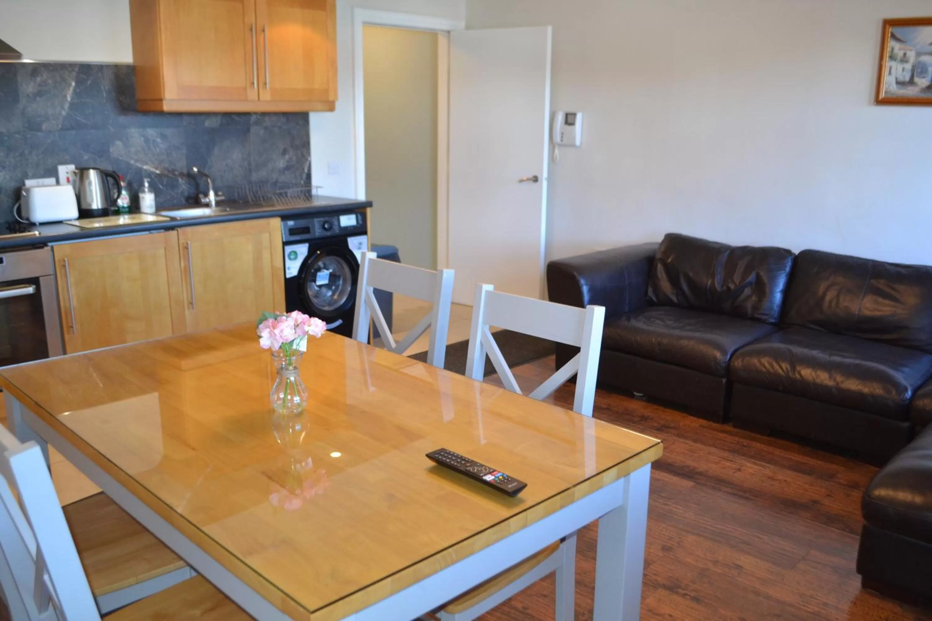 Kitchen or kitchenette in Walsh's Hotel and Apartments