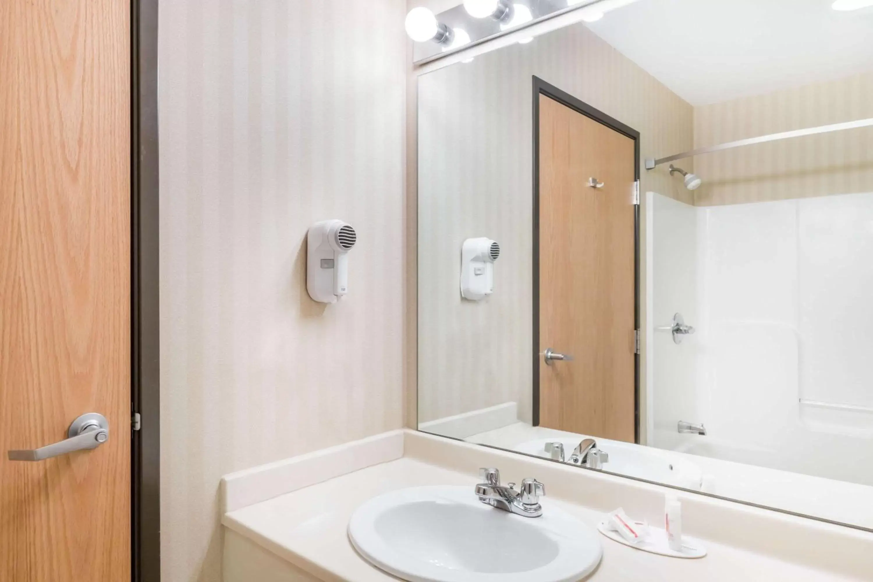 Bathroom in Days Inn & Suites by Wyndham Bridgeport - Clarksburg