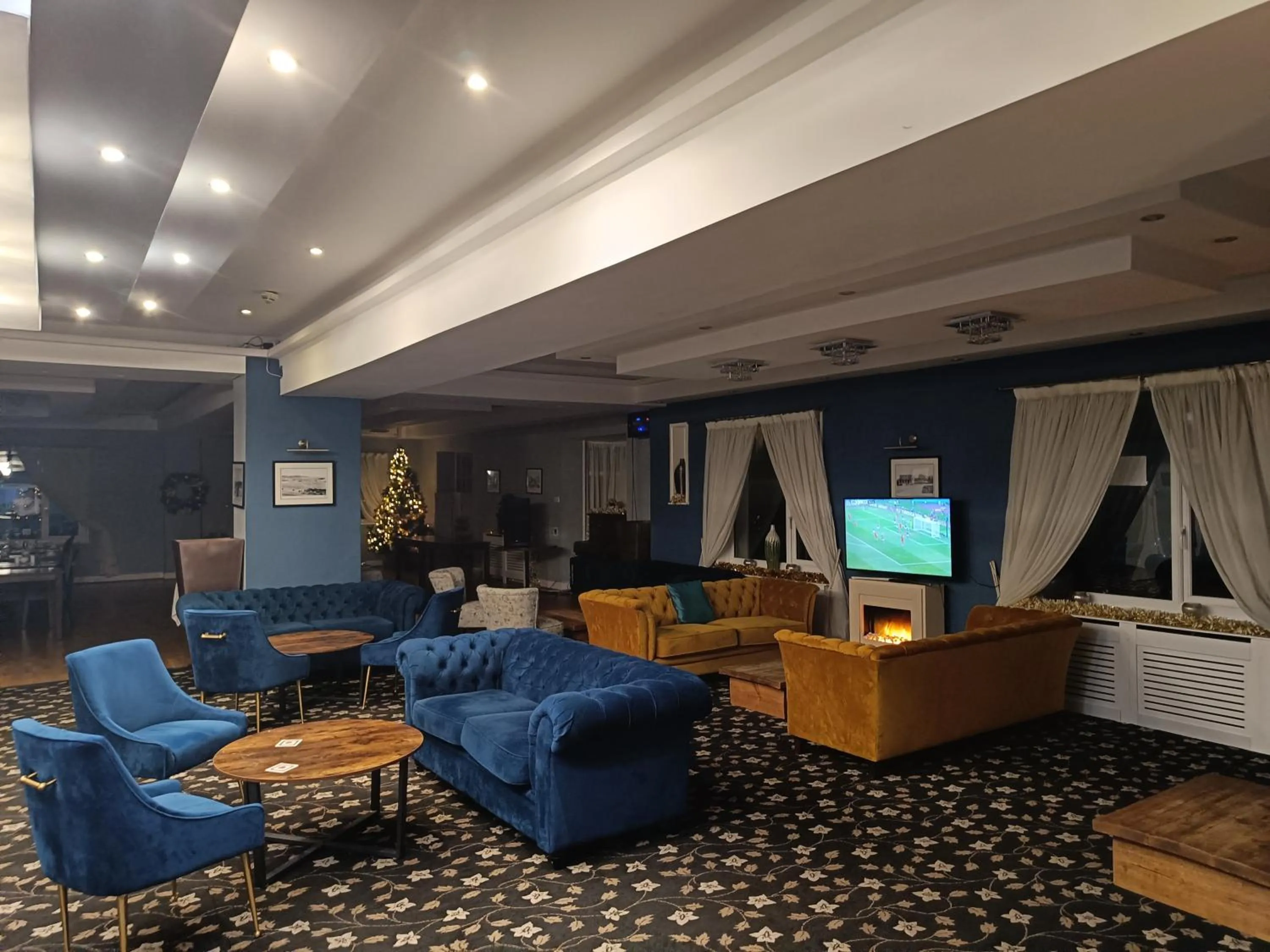 Communal lounge/ TV room in Torbay Court Hotel