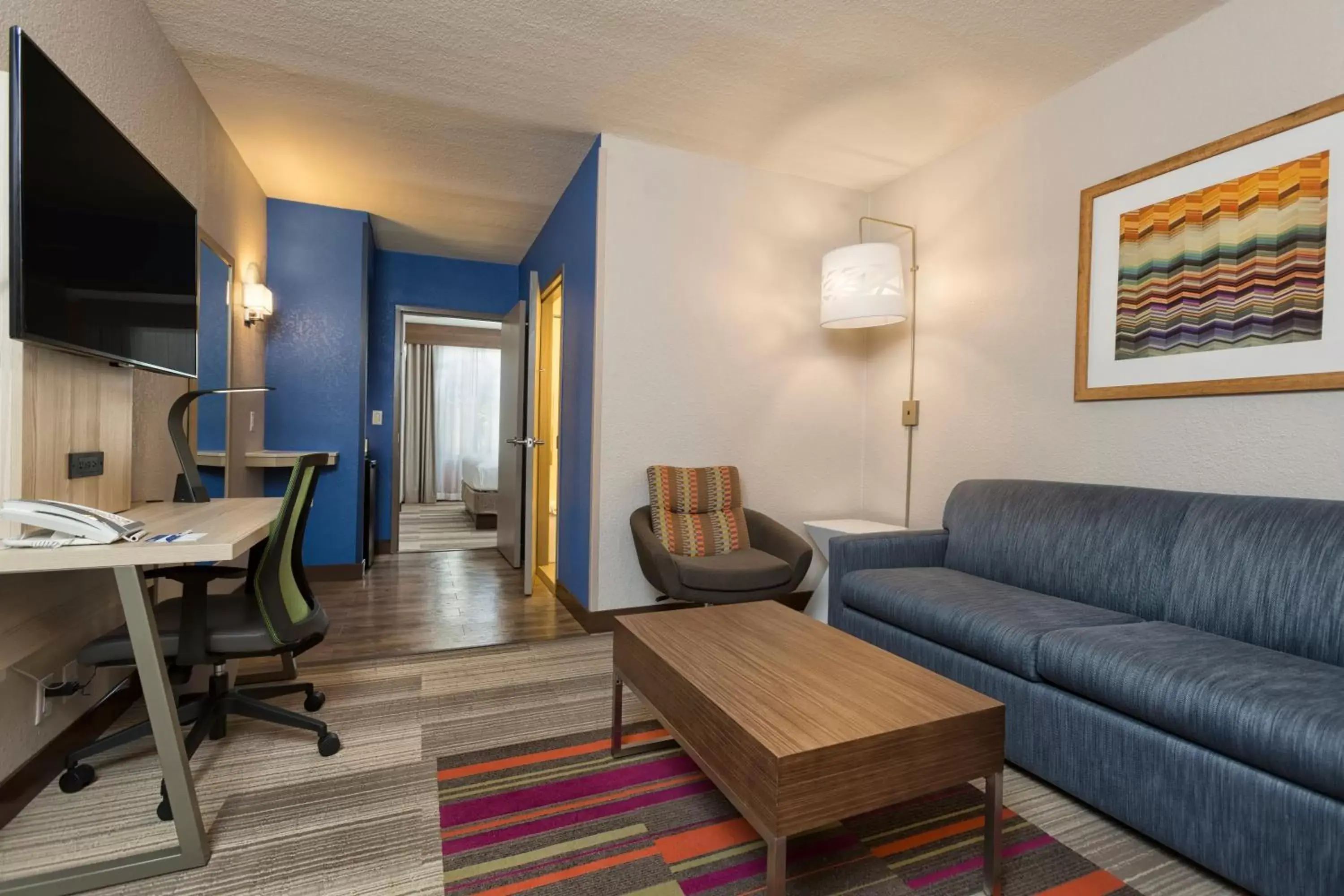 Bedroom, Seating Area in Holiday Inn Express & Suites S Lake Buena Vista, an IHG Hotel