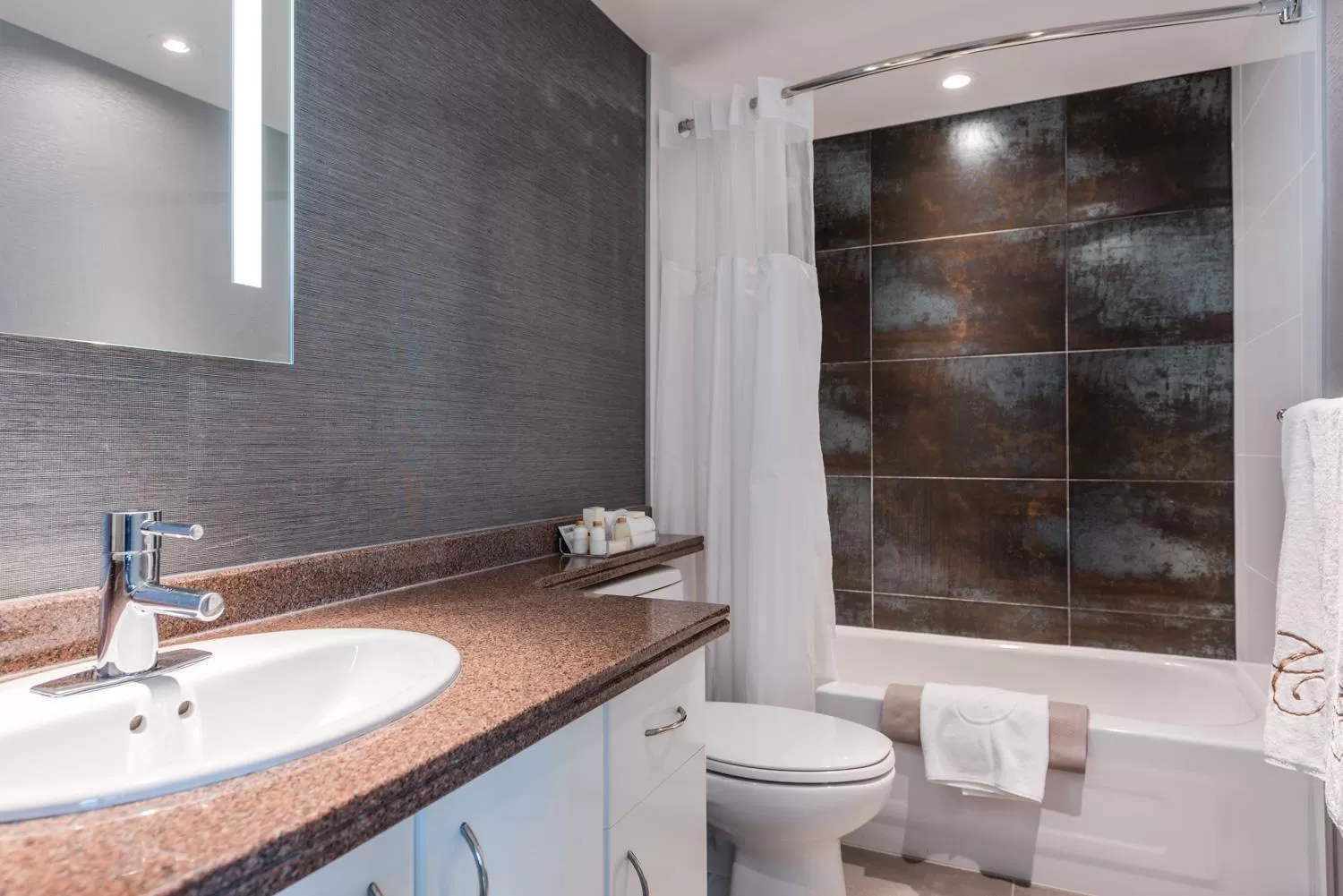 Bathroom in Carmana Hotel & Suites
