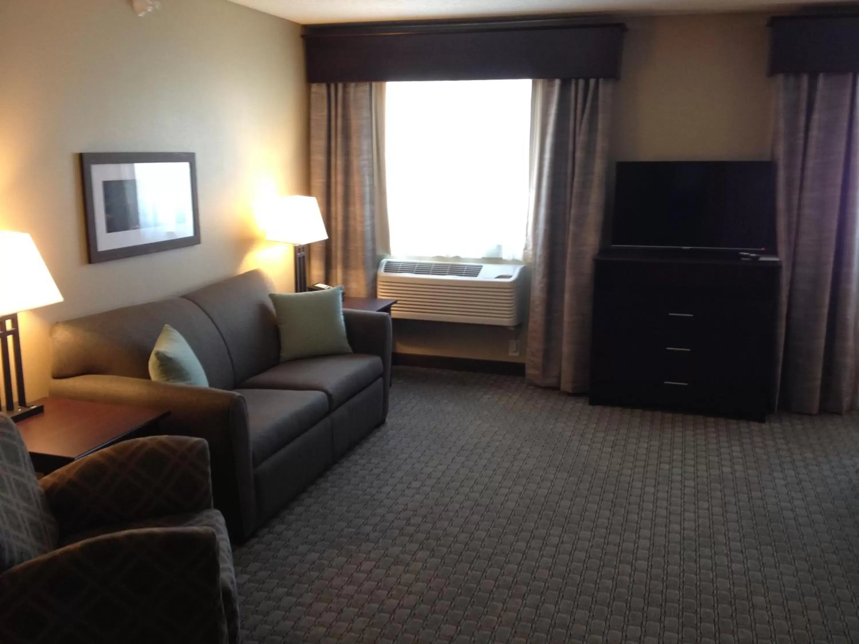 TV and multimedia, Seating Area in GrandStay Hotel & Suites - Glenwood
