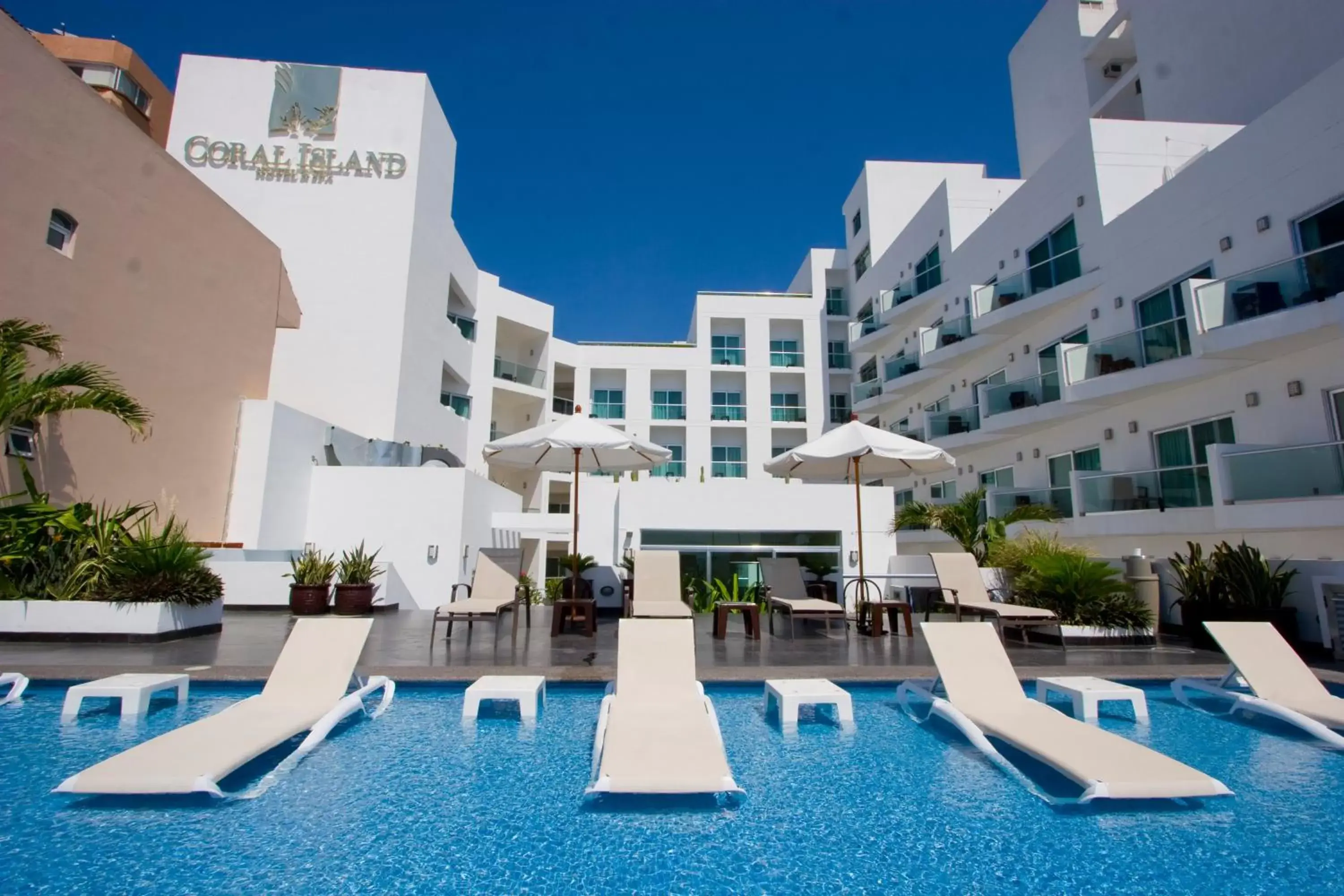 Property building, Swimming Pool in Coral Island Beach View Hotel