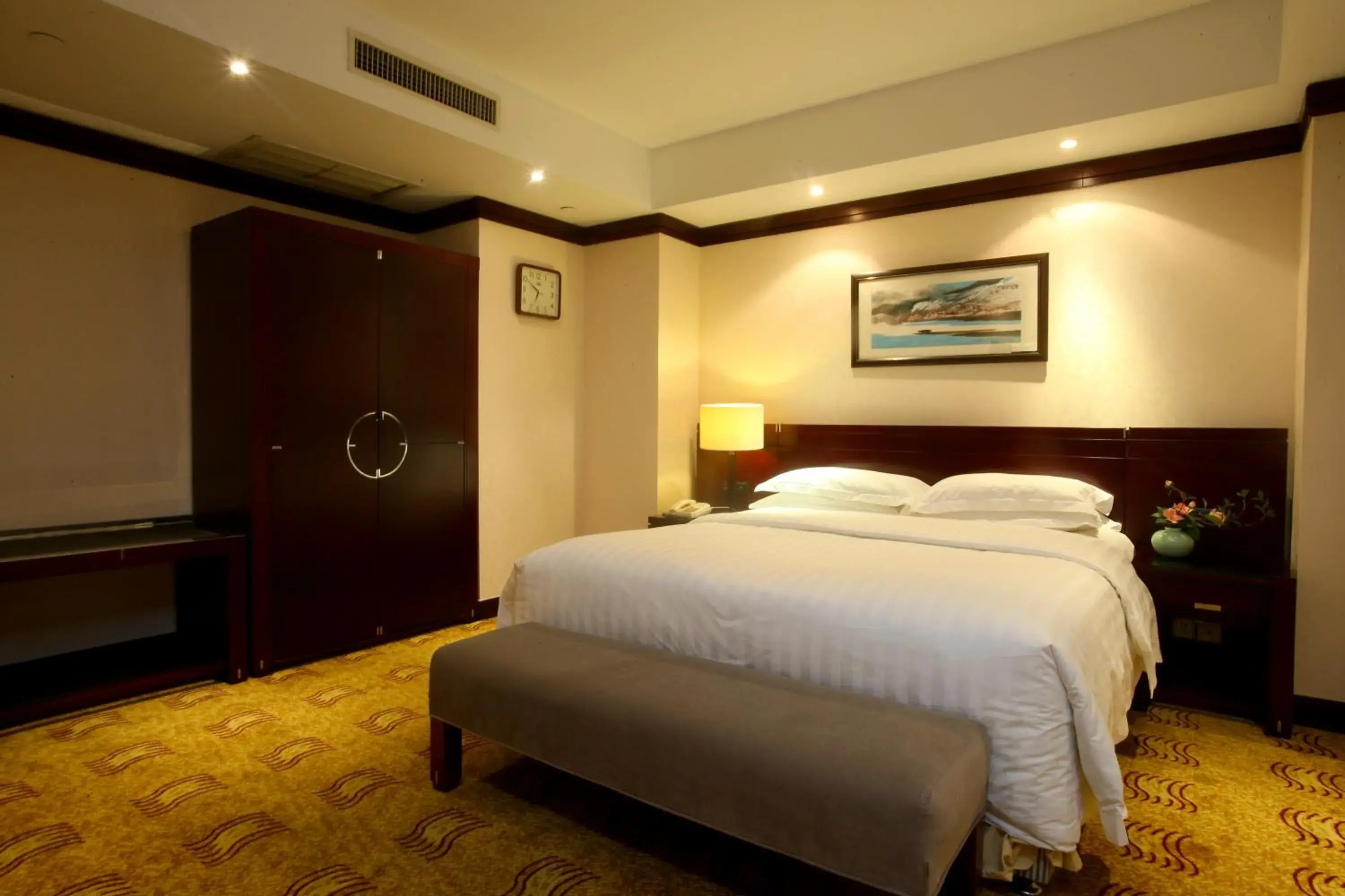 Bed in Poly Plaza Hotel