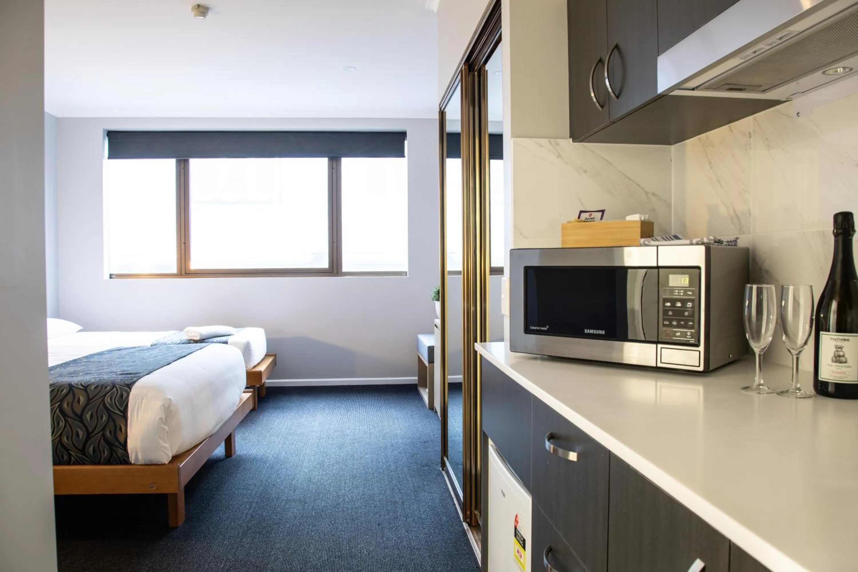 Kitchen or kitchenette, Bed in Madison Capital Executive Apartments