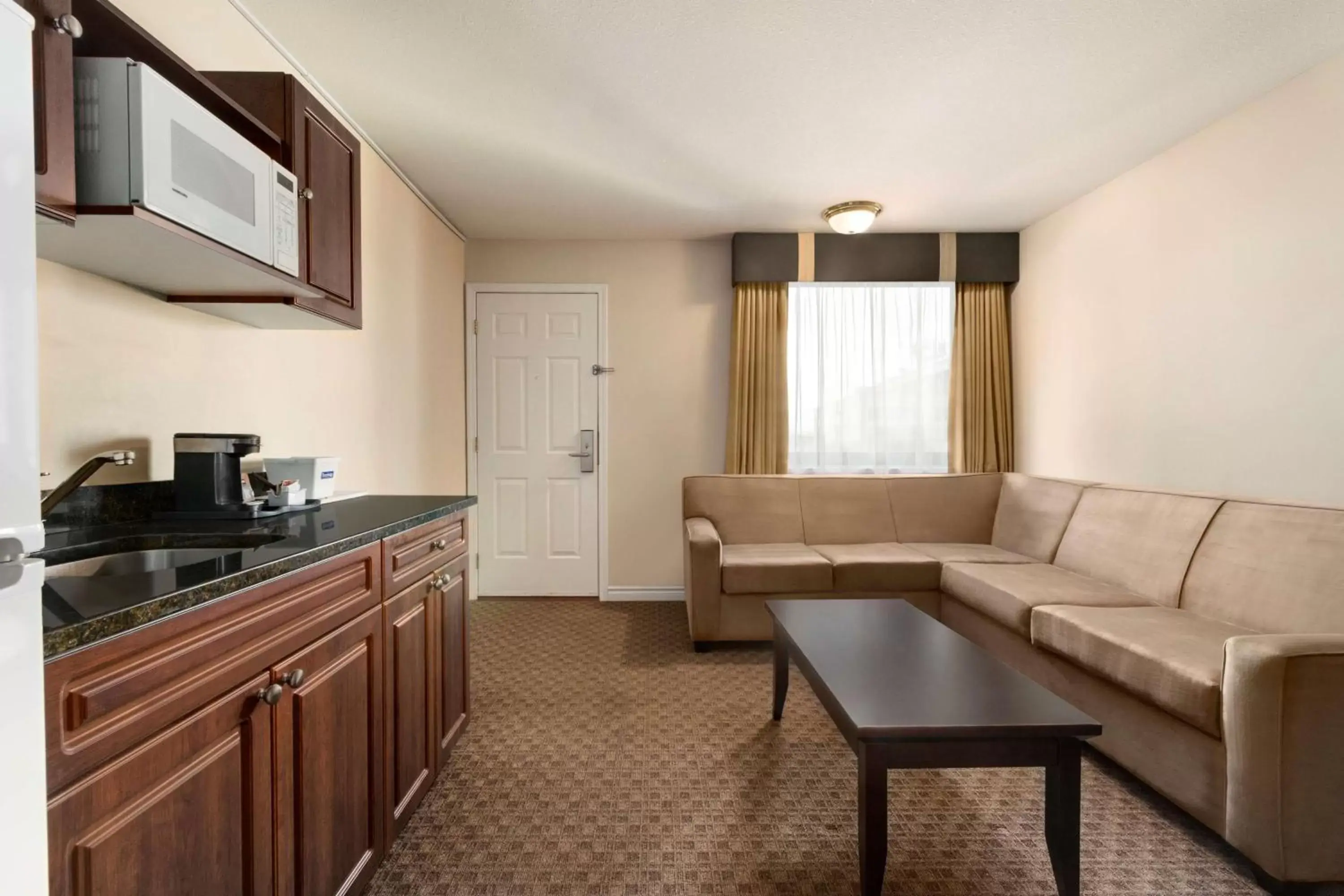 One Bedroom Suite with Kitchenette in Travelodge by Wyndham Kamloops Mountview