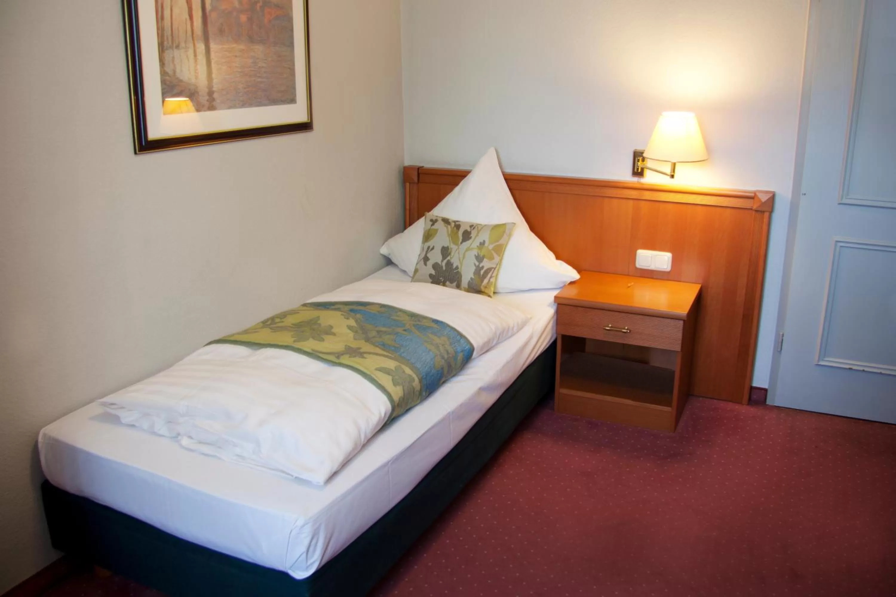 Bed in INA Hotel Royal