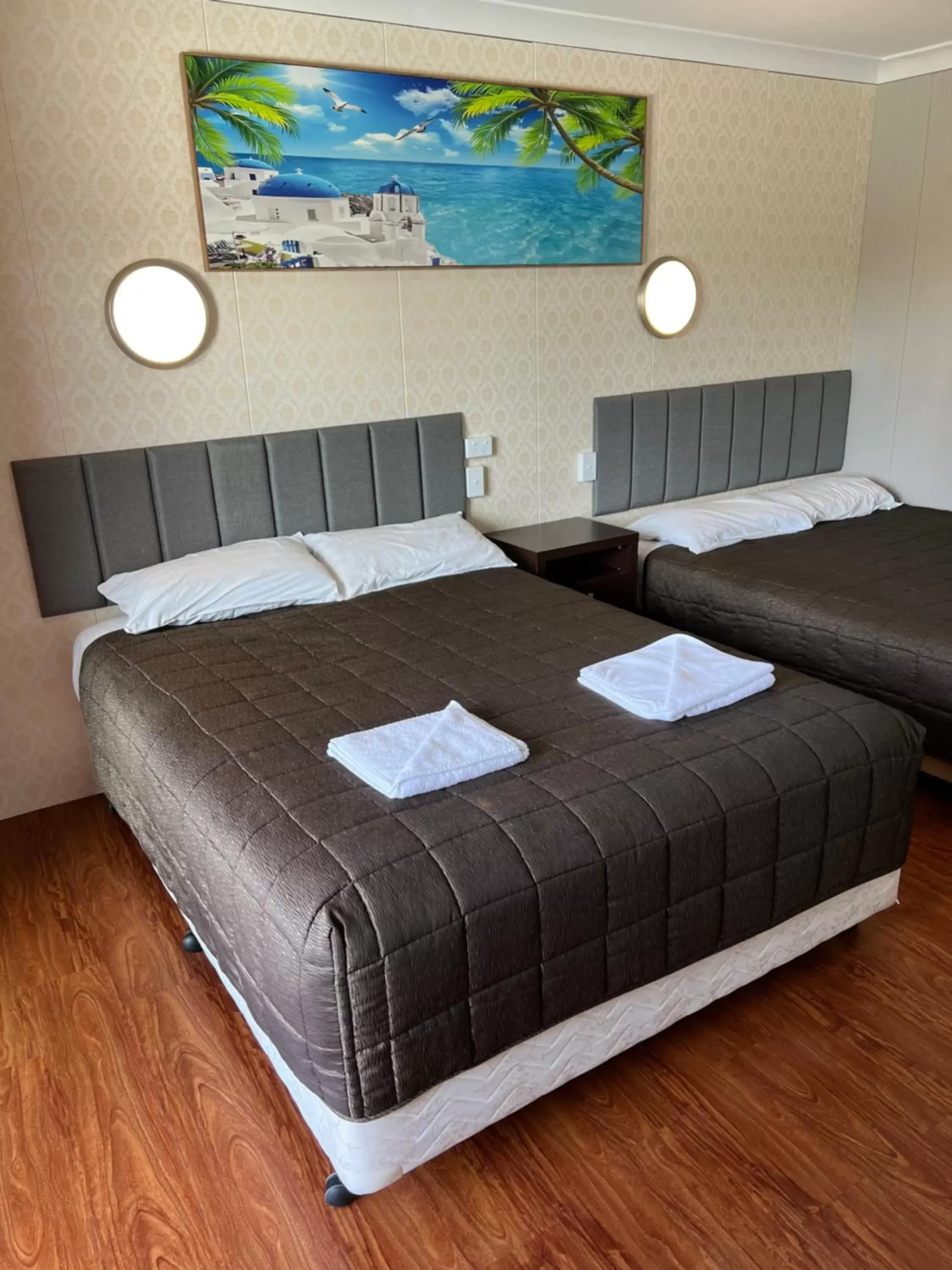 Bed in Central Jetty Motel