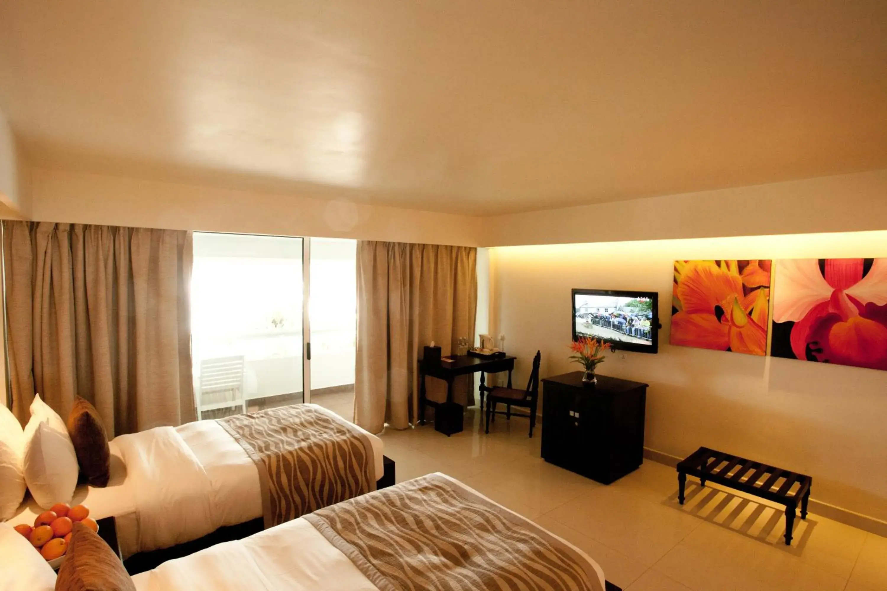 Bed, TV/Entertainment Center in Mount Lavinia Beach Hotel