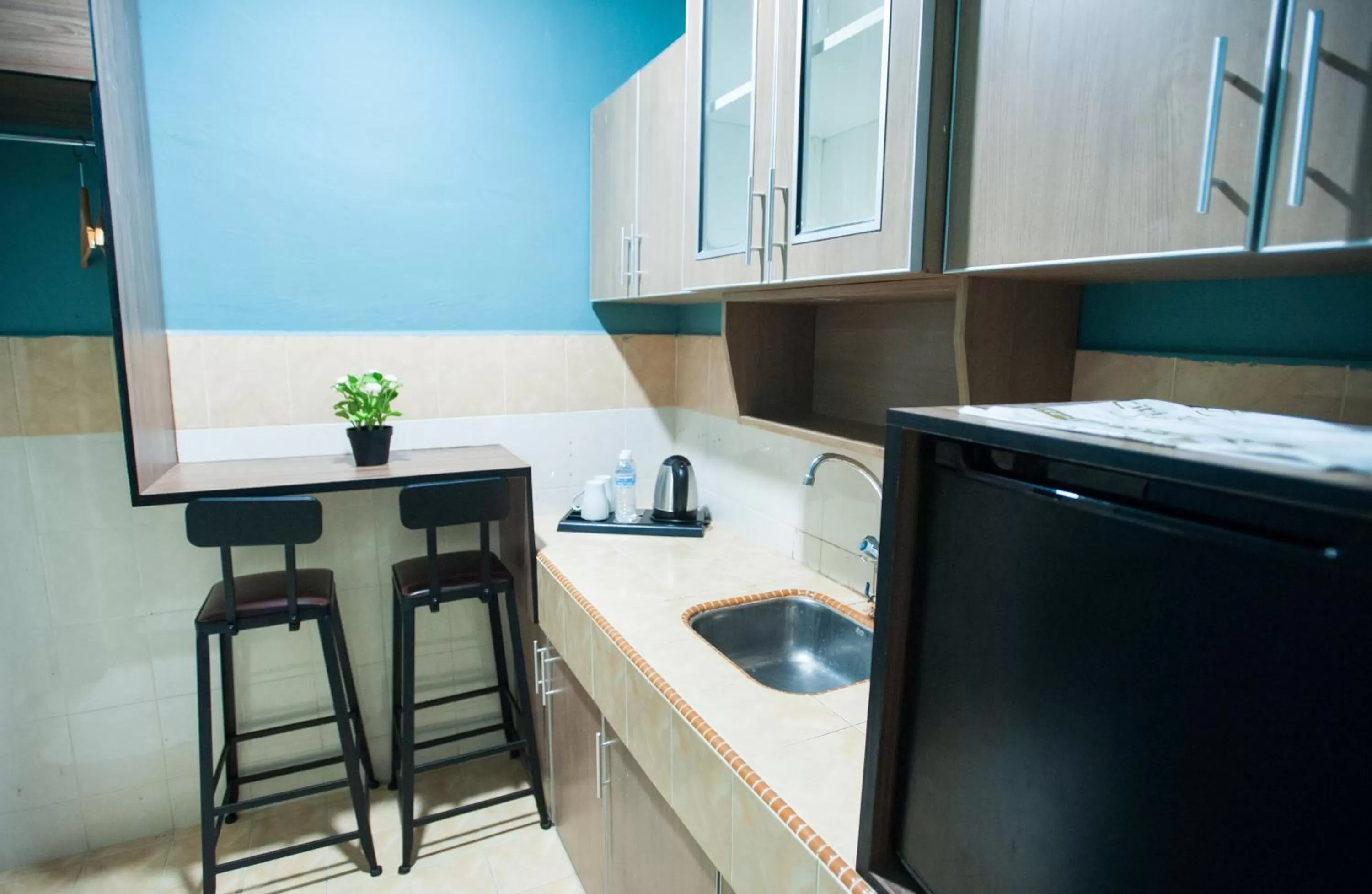 Kitchen or kitchenette in DJ Citi Point Hotel