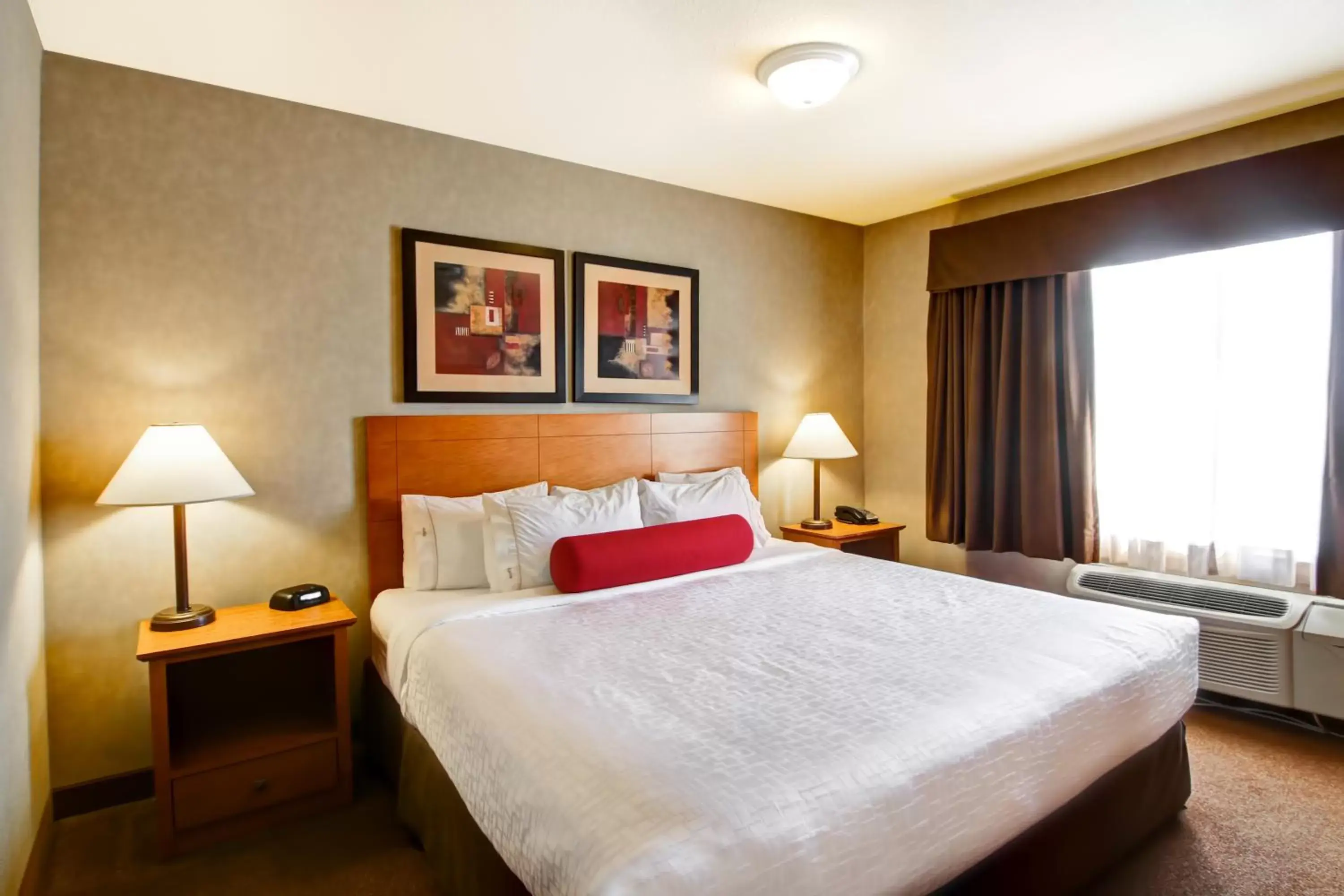 Swimming pool, Bed in Ramada by Wyndham Ponoka