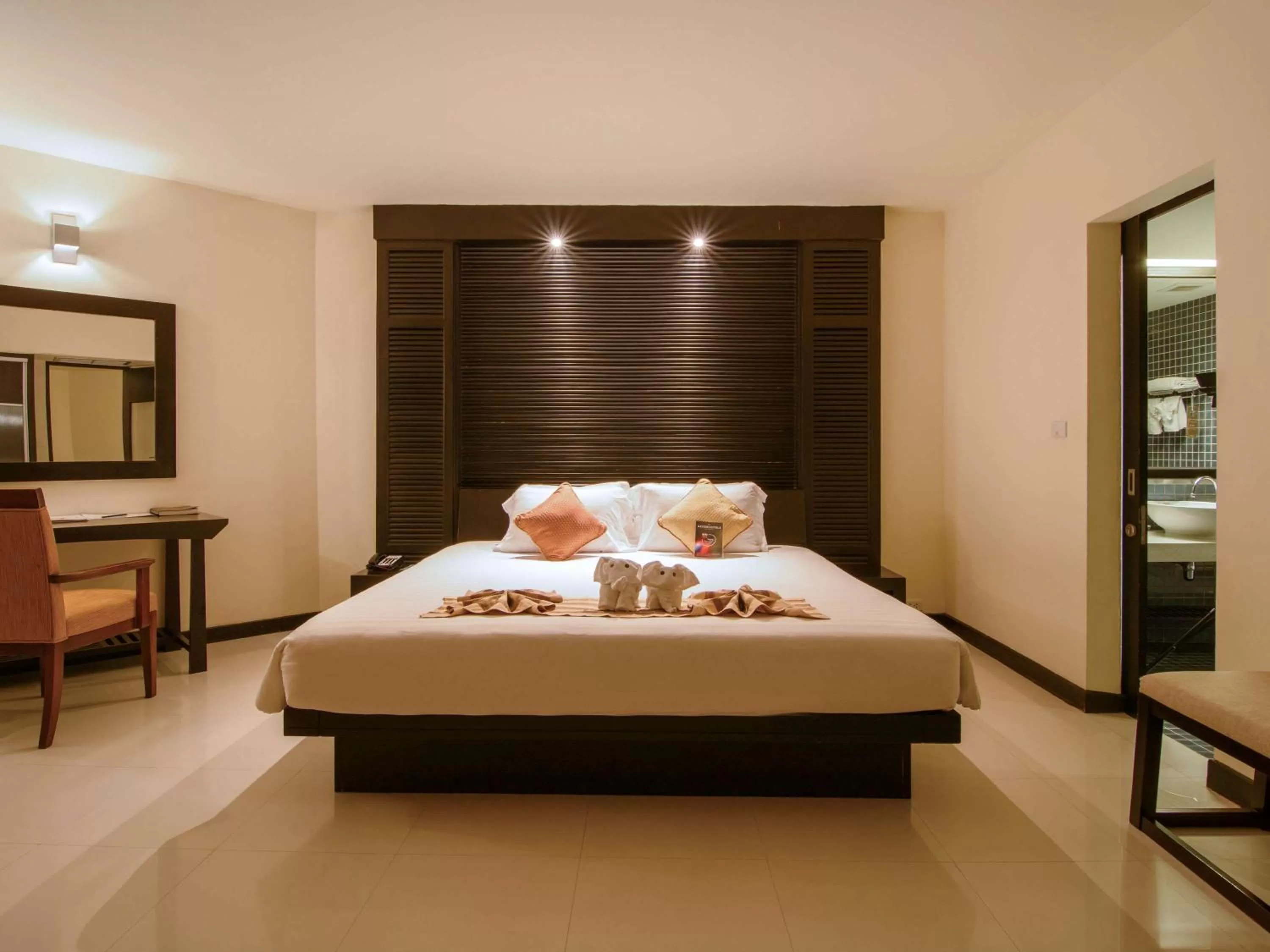 Photo of the whole room, Bed in The Nouveau Chumphon Beach Resort And Golf