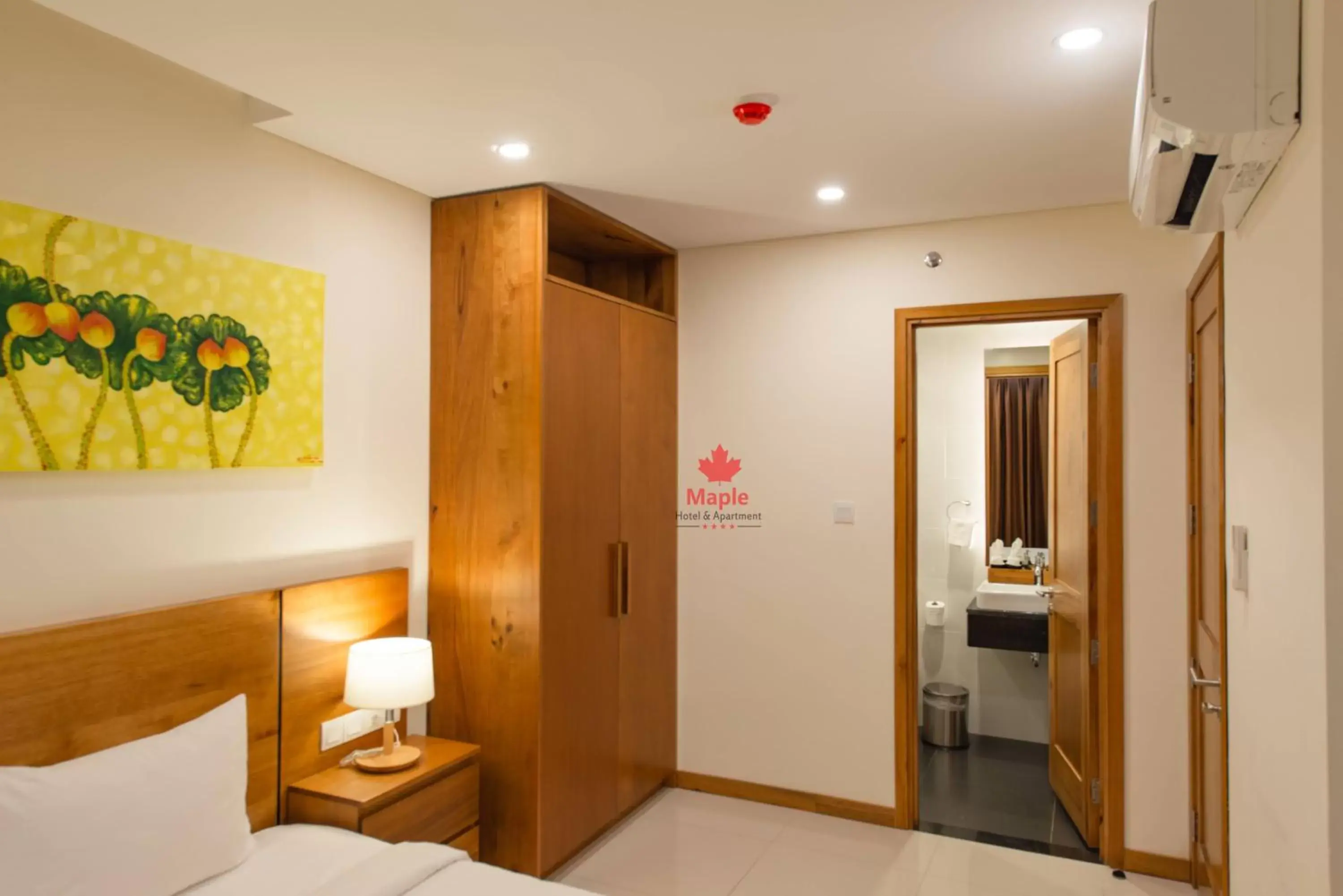 Bedroom in Maple Hotel & Apartment