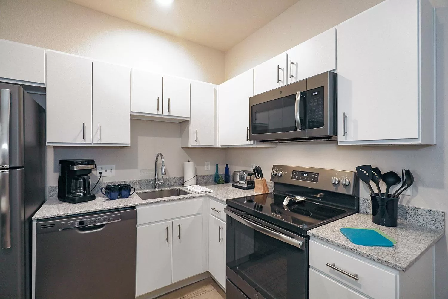 kitchen in WaterWalk Extended Stay by Wyndham Minneapolis - Plymouth