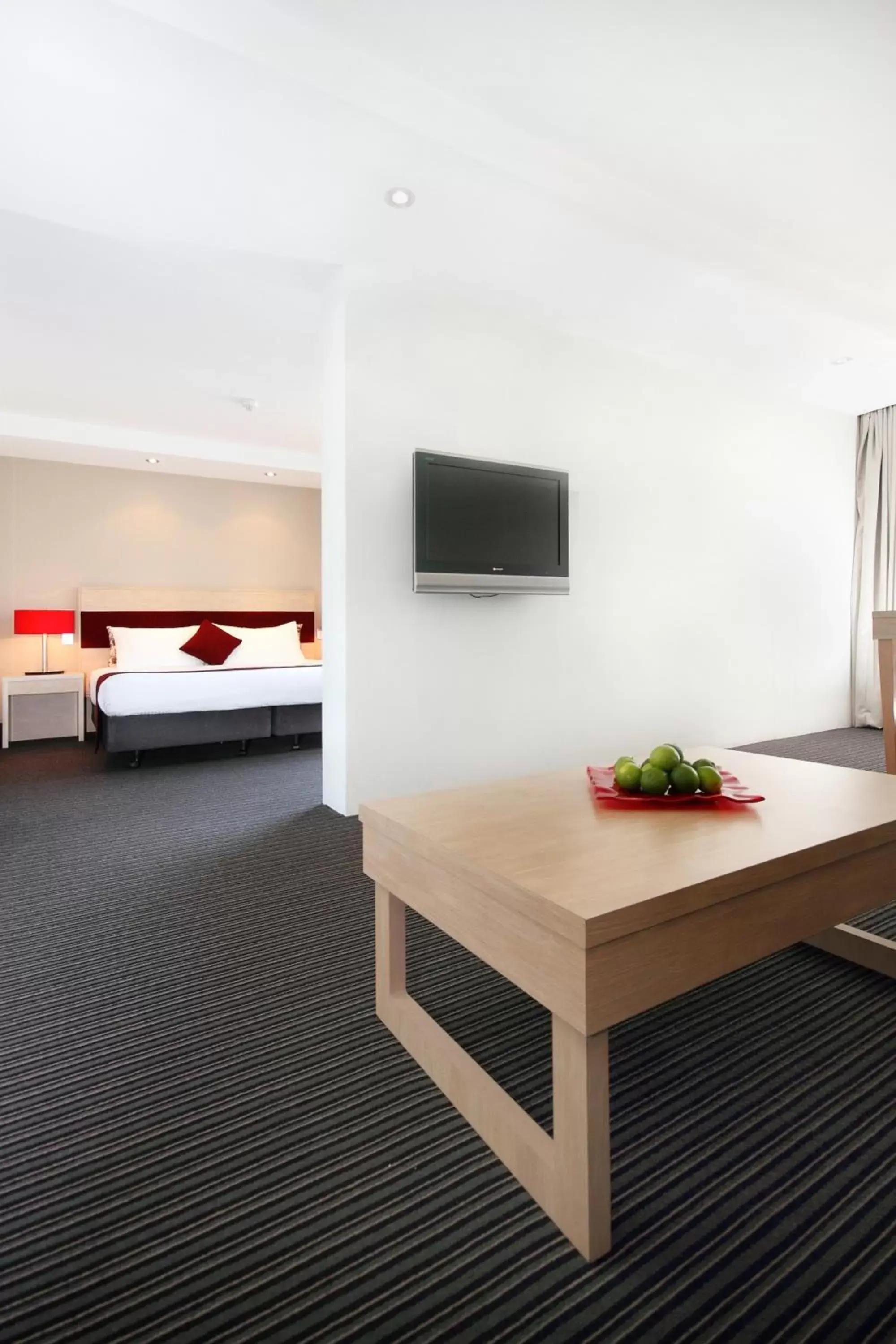 Bed, TV/Entertainment Center in Central Studio Hotel Sydney
