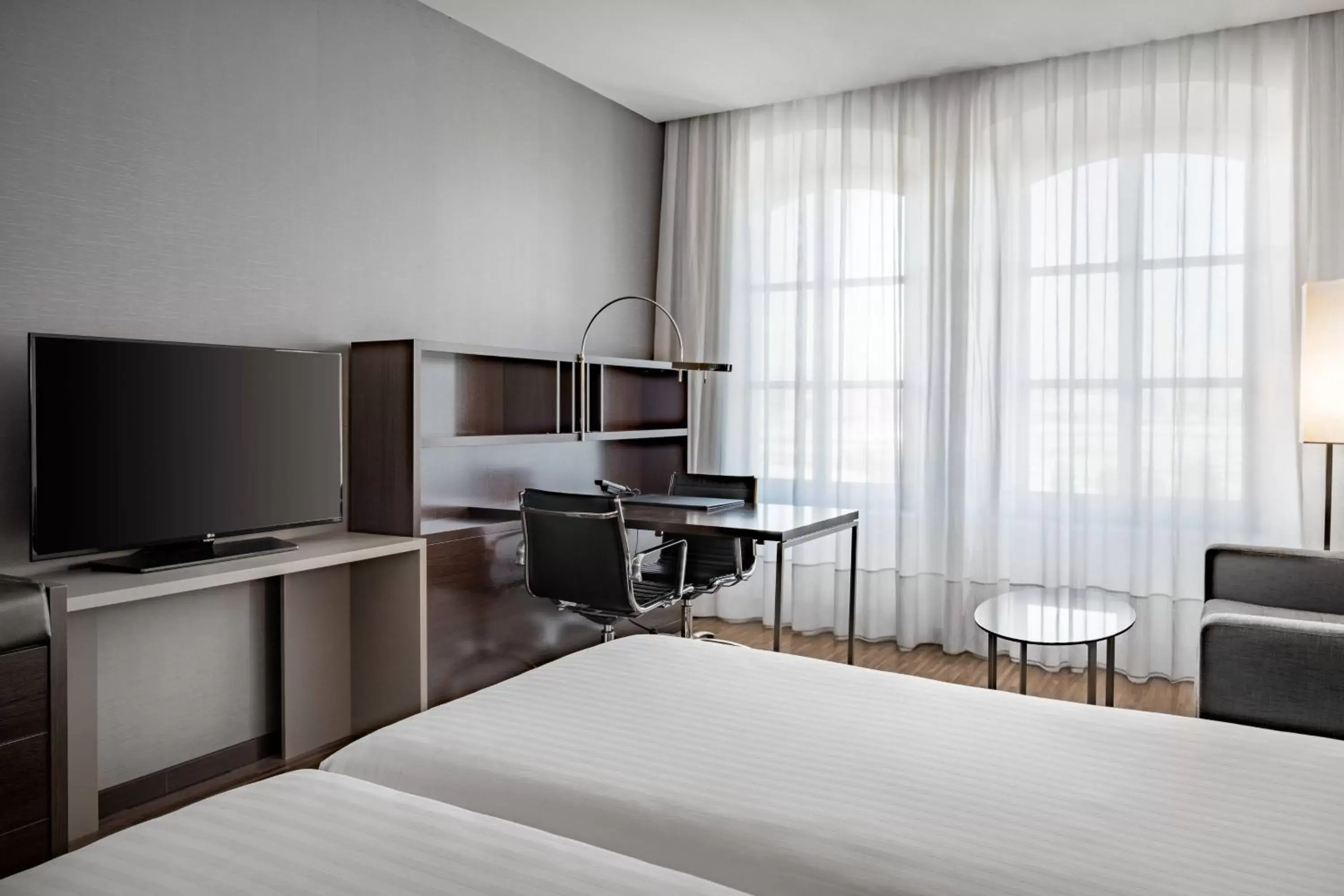 Photo of the whole room, TV/Entertainment Center in AC Hotel Torino by Marriott