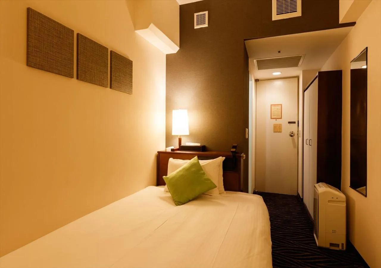 Bed in Kanazawa New Grand Hotel Prestige