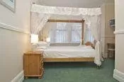 Bedroom in All Seasons Lodge Hotel