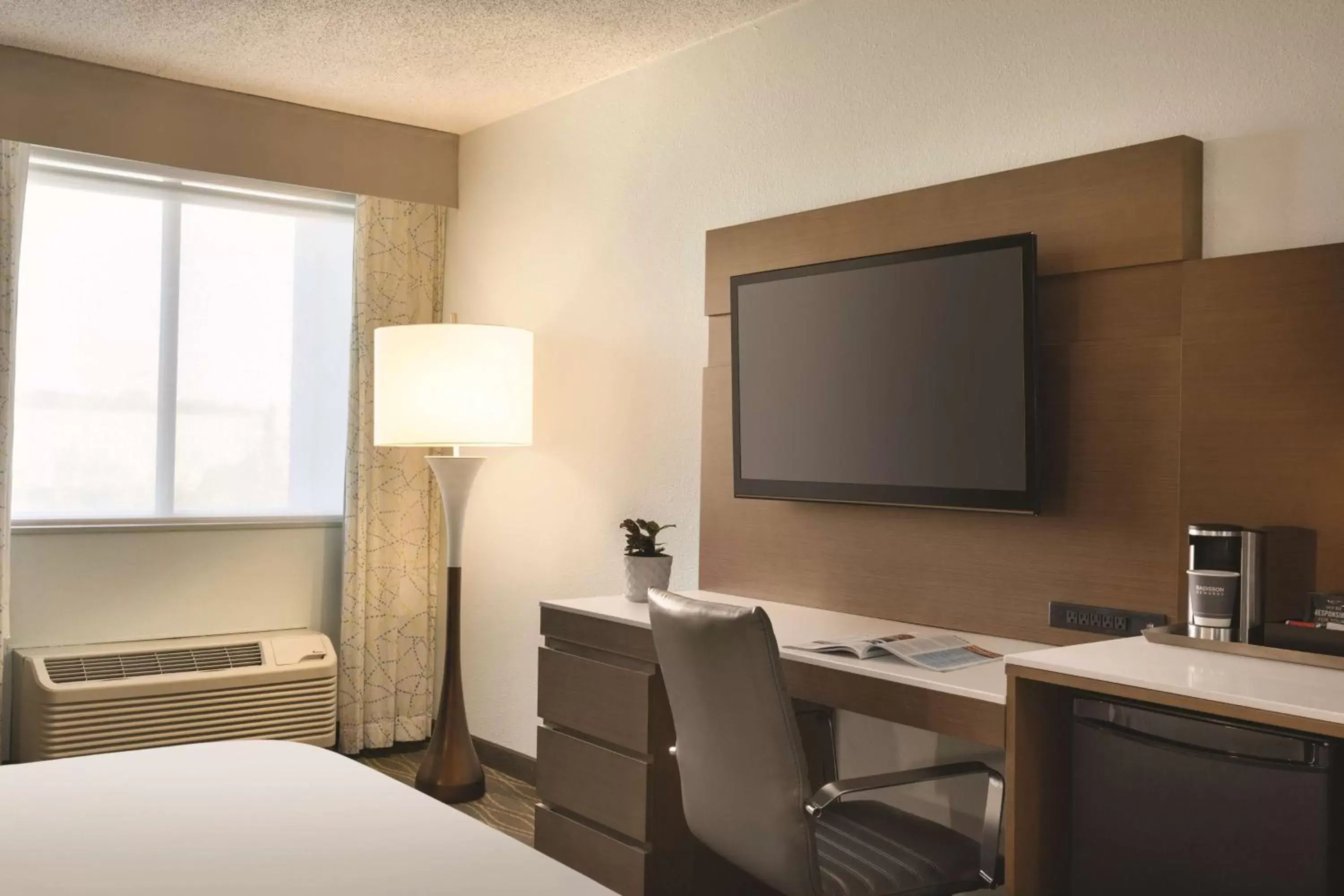 Photo of the whole room, TV/Entertainment Center in Radisson Hotel Grand Rapids Riverfront