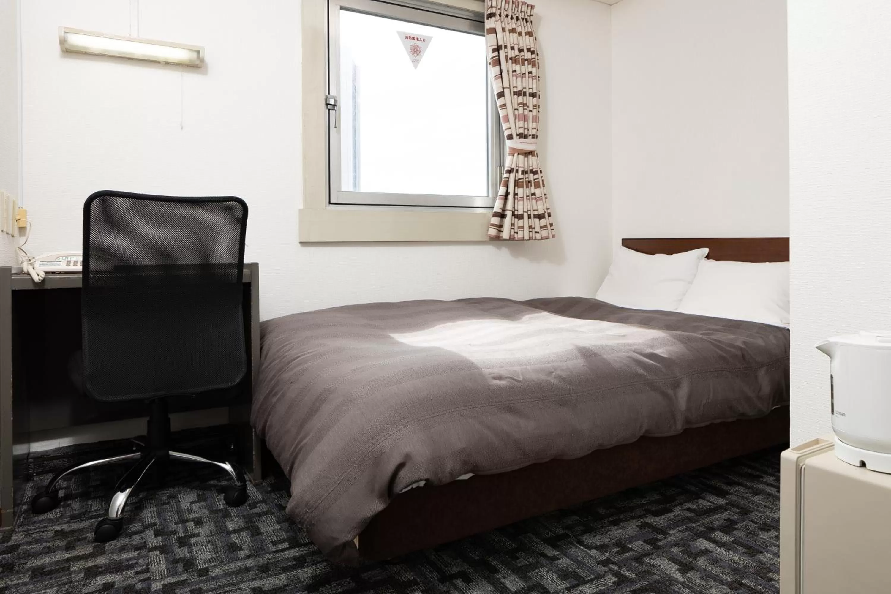 Bed in Kurashiki Station Hotel