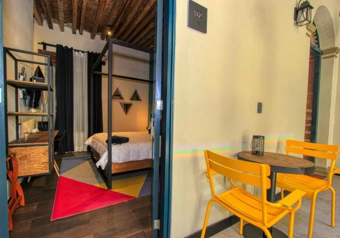 Bed in Antigua Trece Hotel Fusión