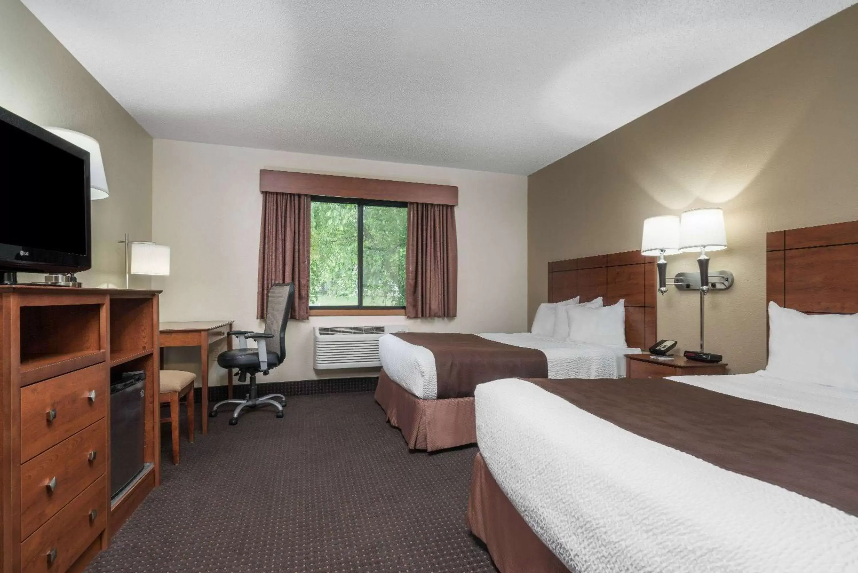 Photo of the whole room, Bed in AmericInn by Wyndham Lake City