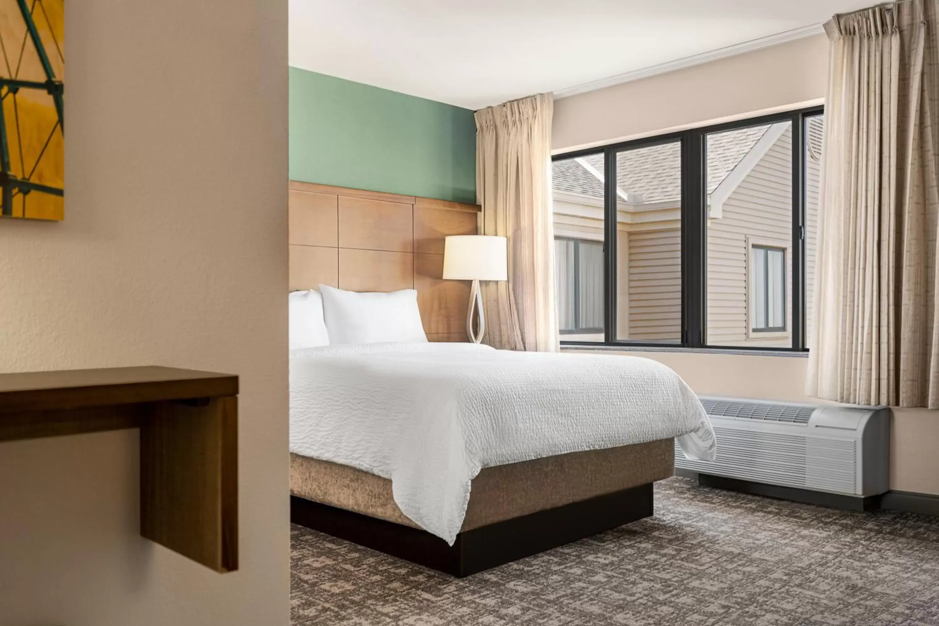Bed in Staybridge Suites Oklahoma City-Quail Springs, an IHG Hotel