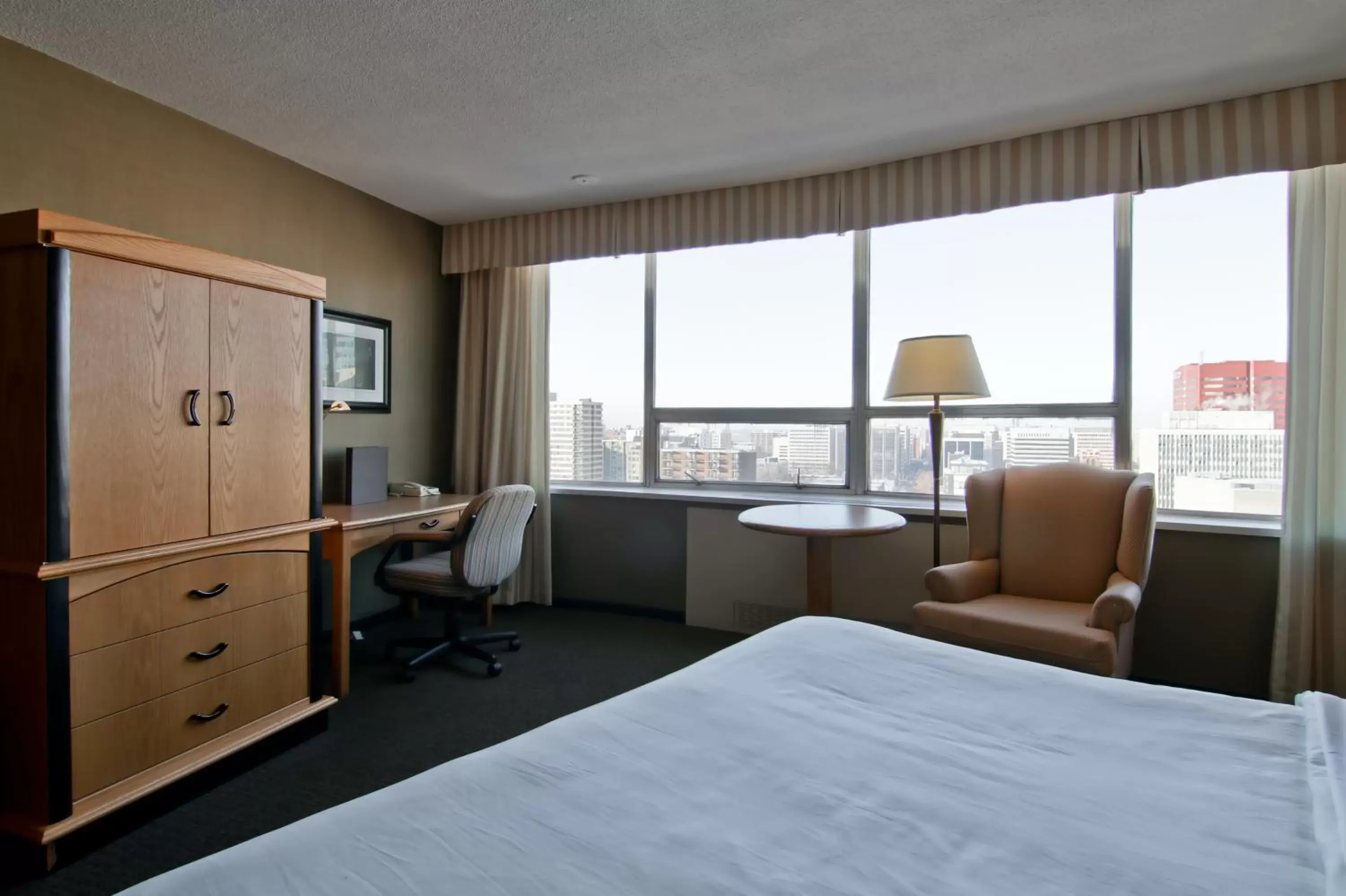 View (from property/room), Bed in Chateau Lacombe Hotel View (from property/room), Bed in Chateau Lacombe Hotel