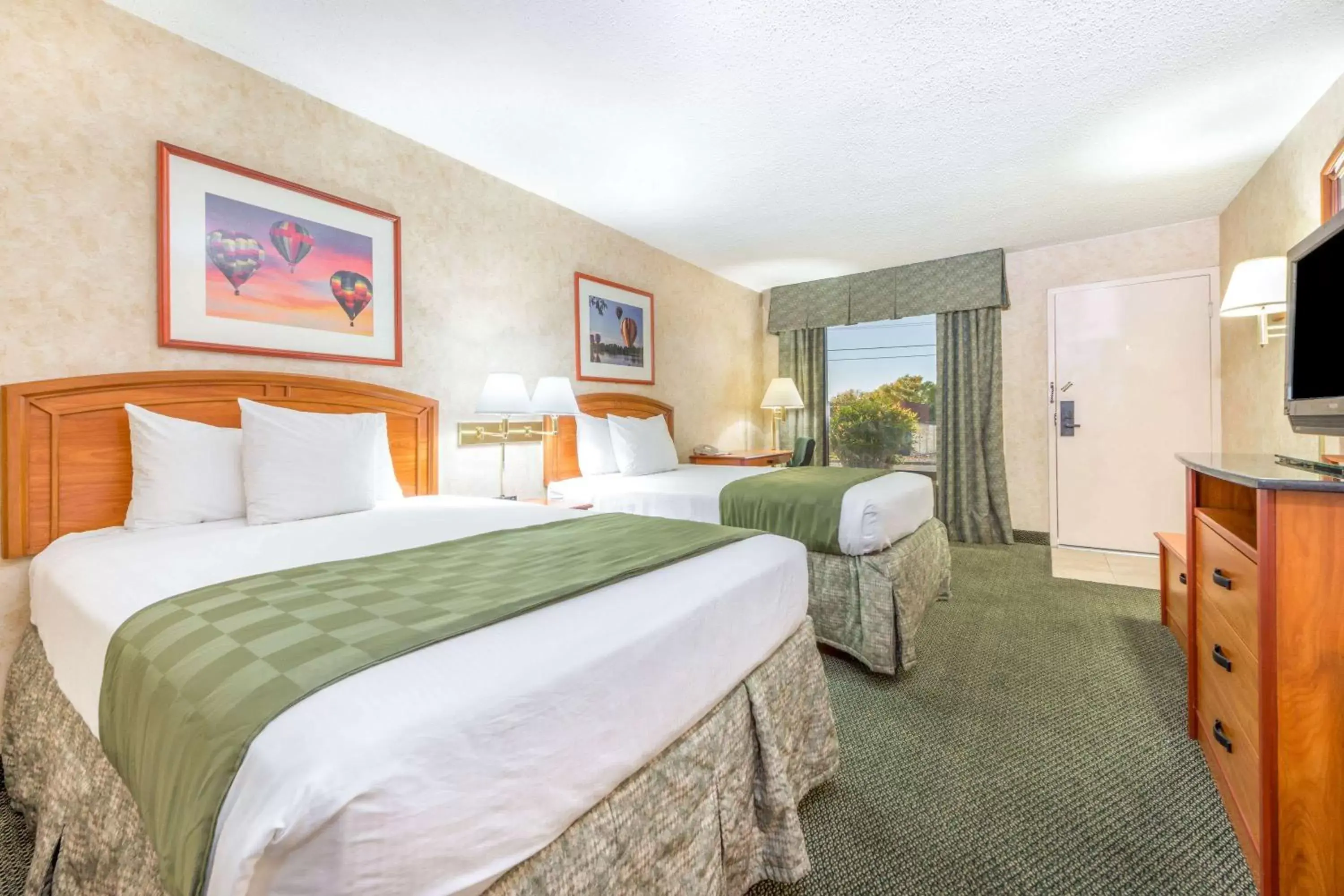 Photo of the whole room, Bed in Days Inn & Suites by Wyndham Albuquerque North