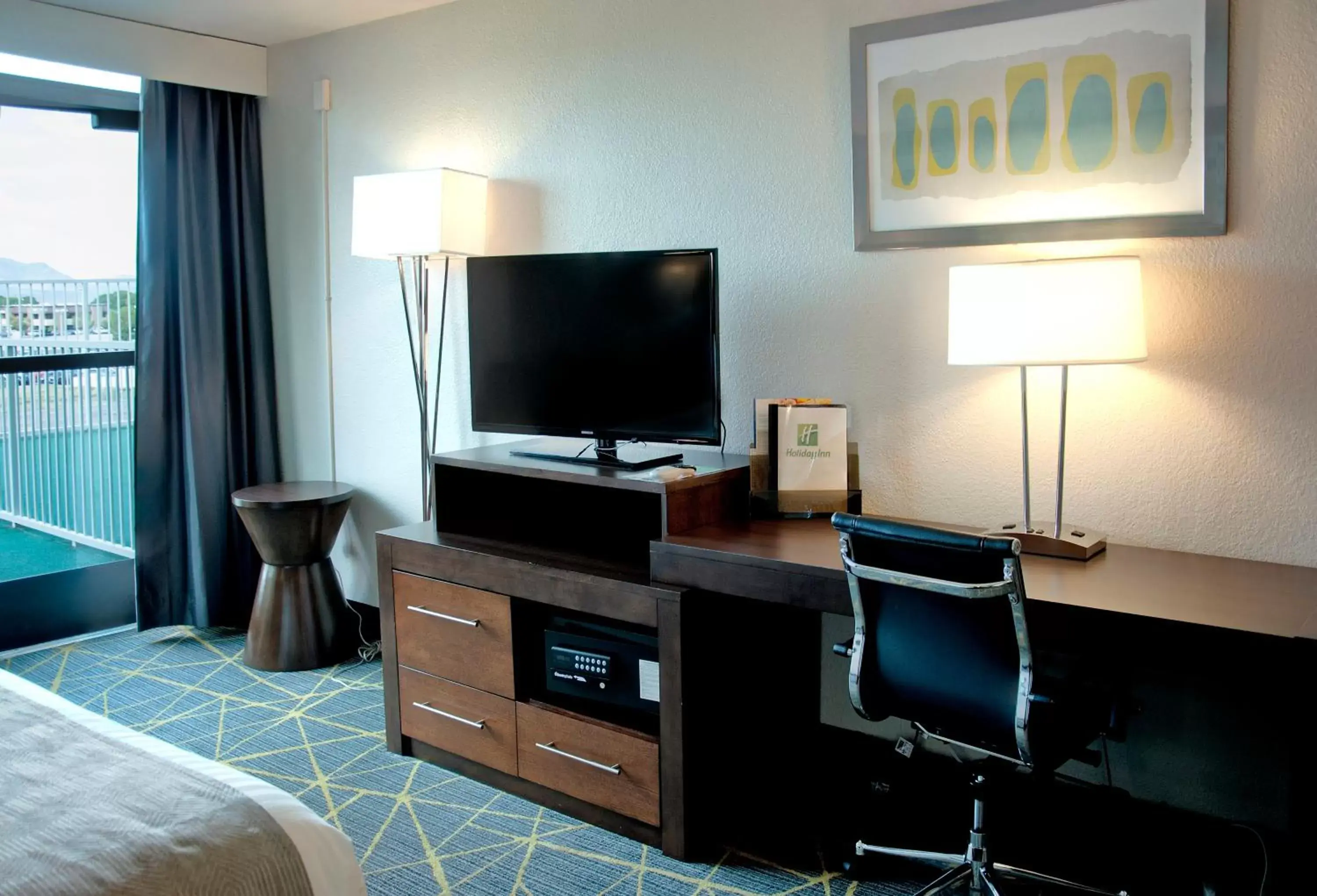 Photo of the whole room, TV/Entertainment Center in Holiday Inn Victorville, an IHG Hotel