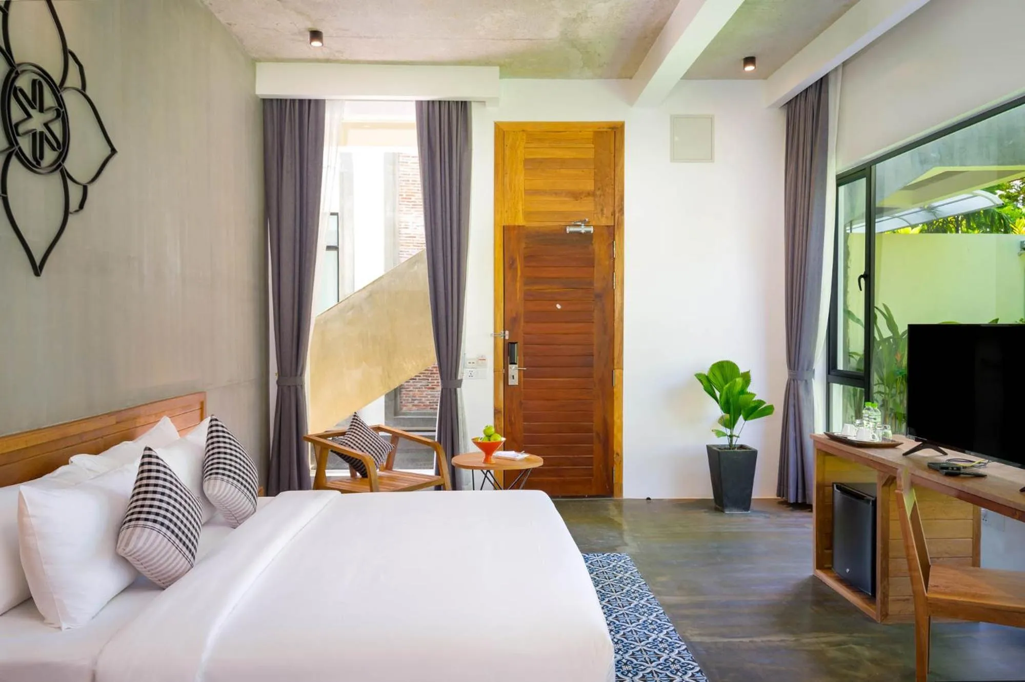 Communal lounge/ TV room, Bed in Phka Chan Hotel