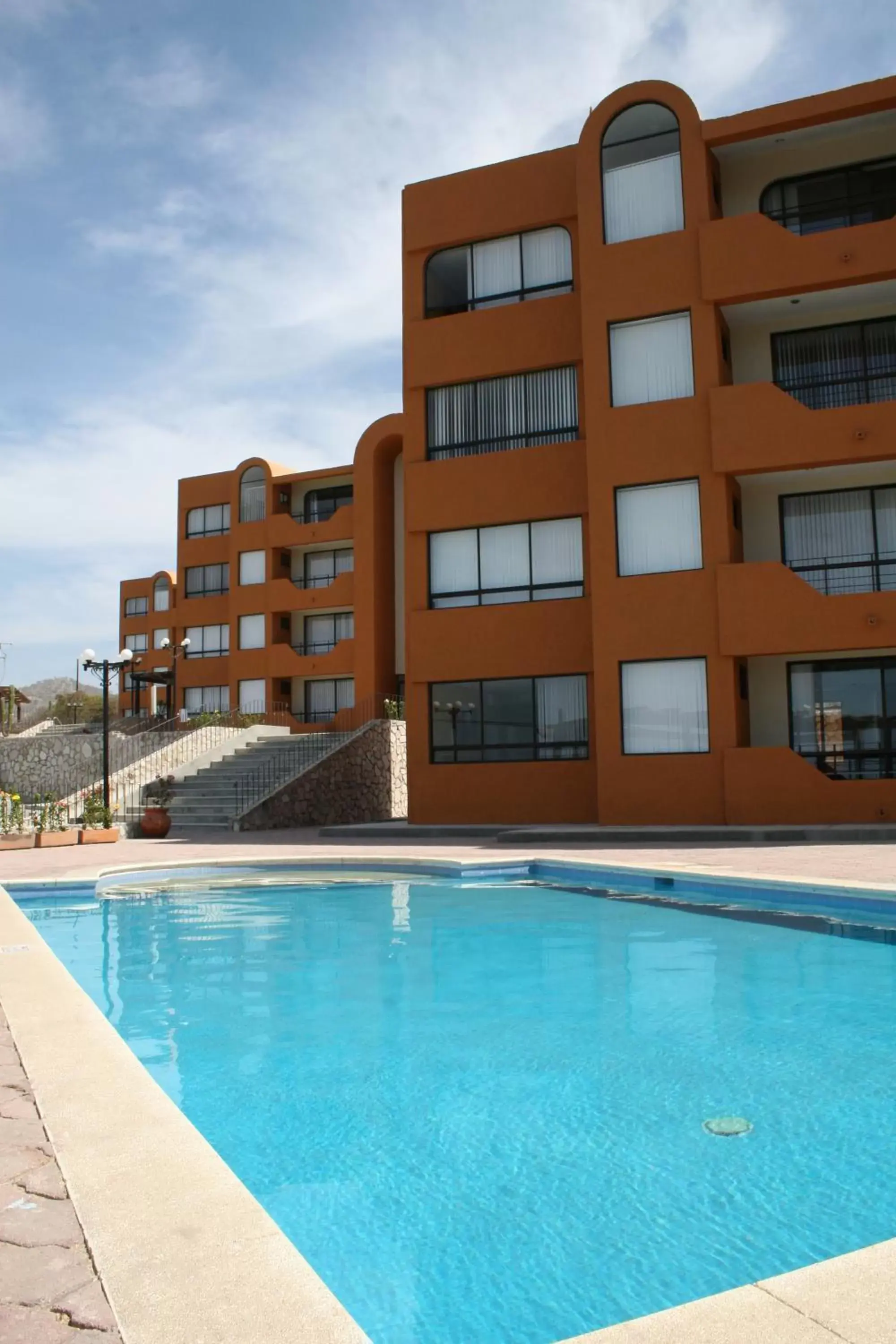 Swimming pool, Property Building in Sunrock Hotel & Suites