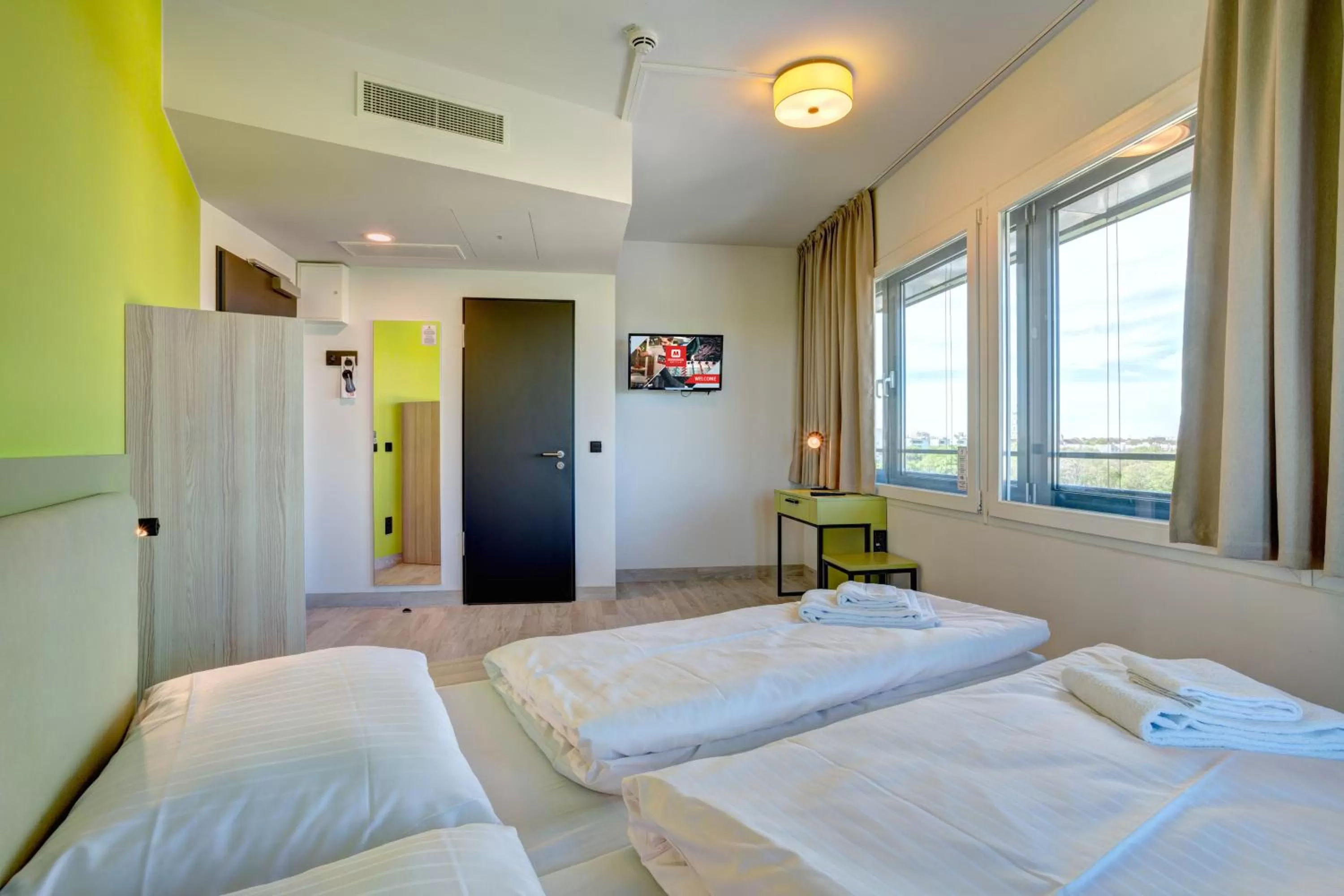 Photo of the whole room, Bed in MEININGER Hotel München Olympiapark