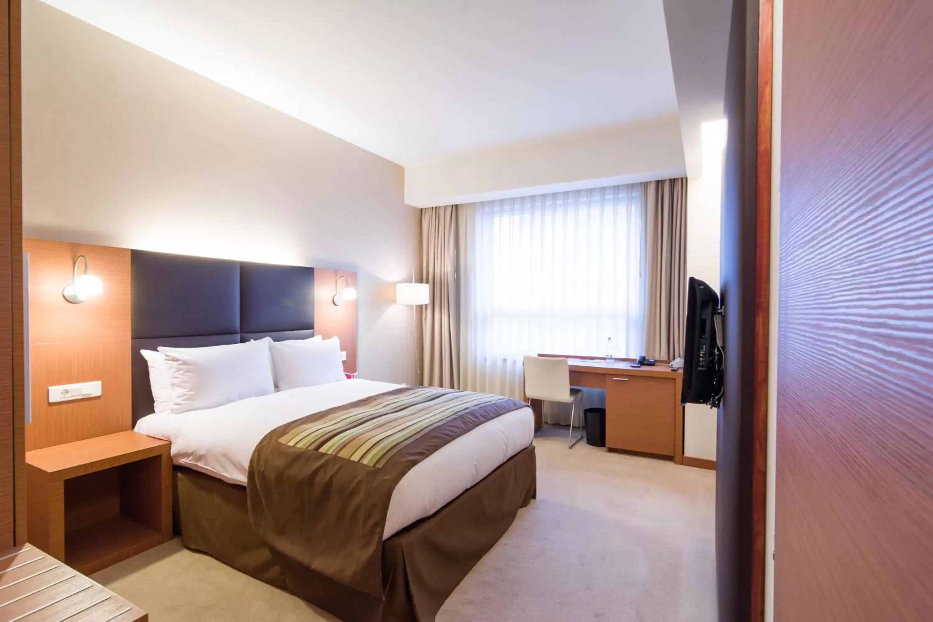 Bed in Ramada by Wyndham Oradea