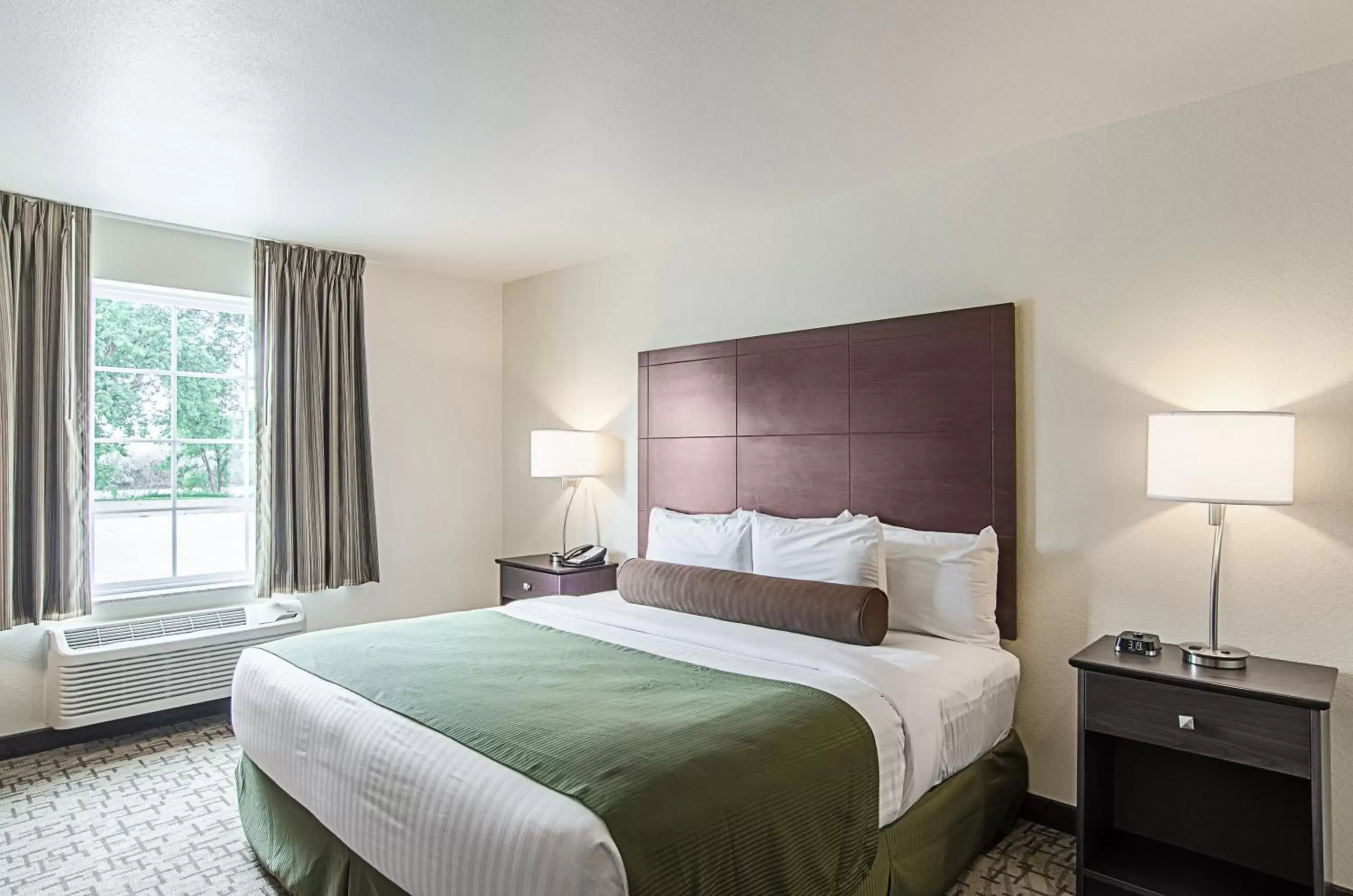 Bed in Cobblestone Inn & Suites - Guernsey Bed in Cobblestone Inn & Suites - Guernsey