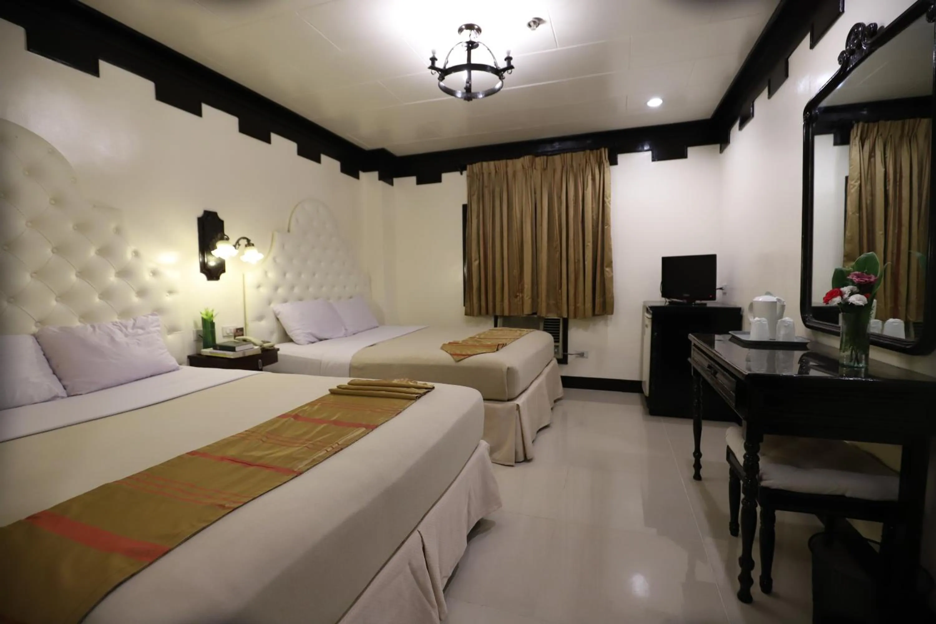 Bed in Camelot Hotel