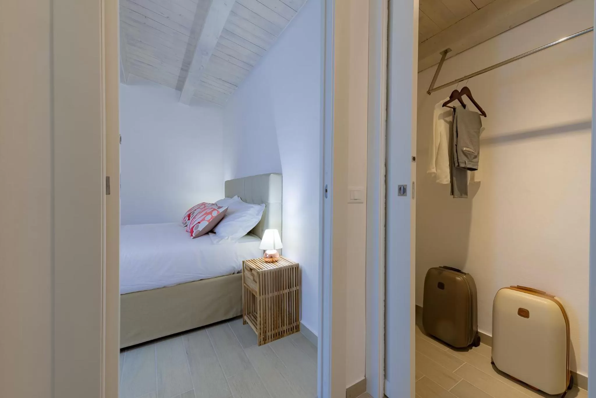 Bed in Le Maestranze Deluxe Rooms