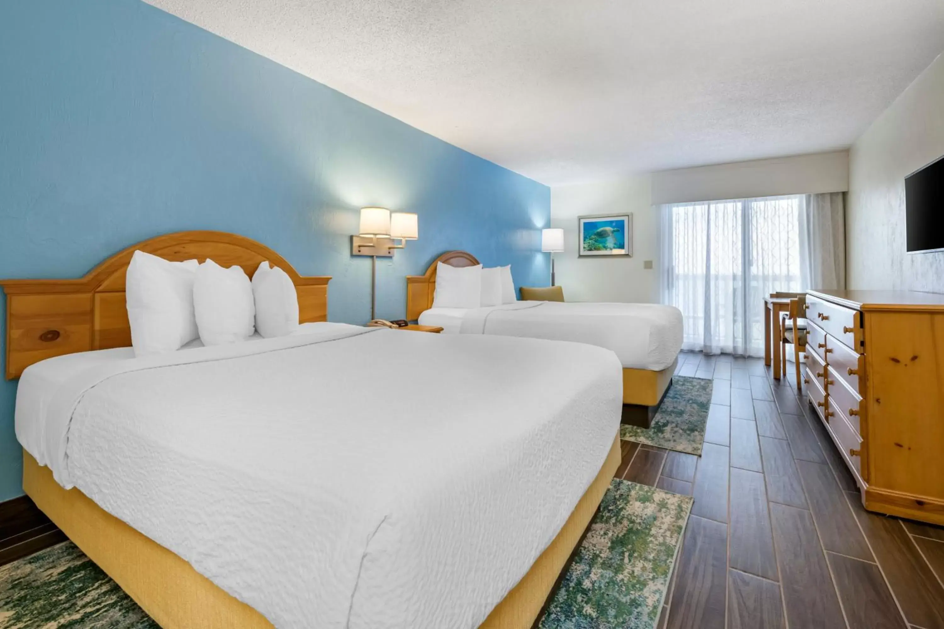 Bed in Tropical Winds Resort Hotel