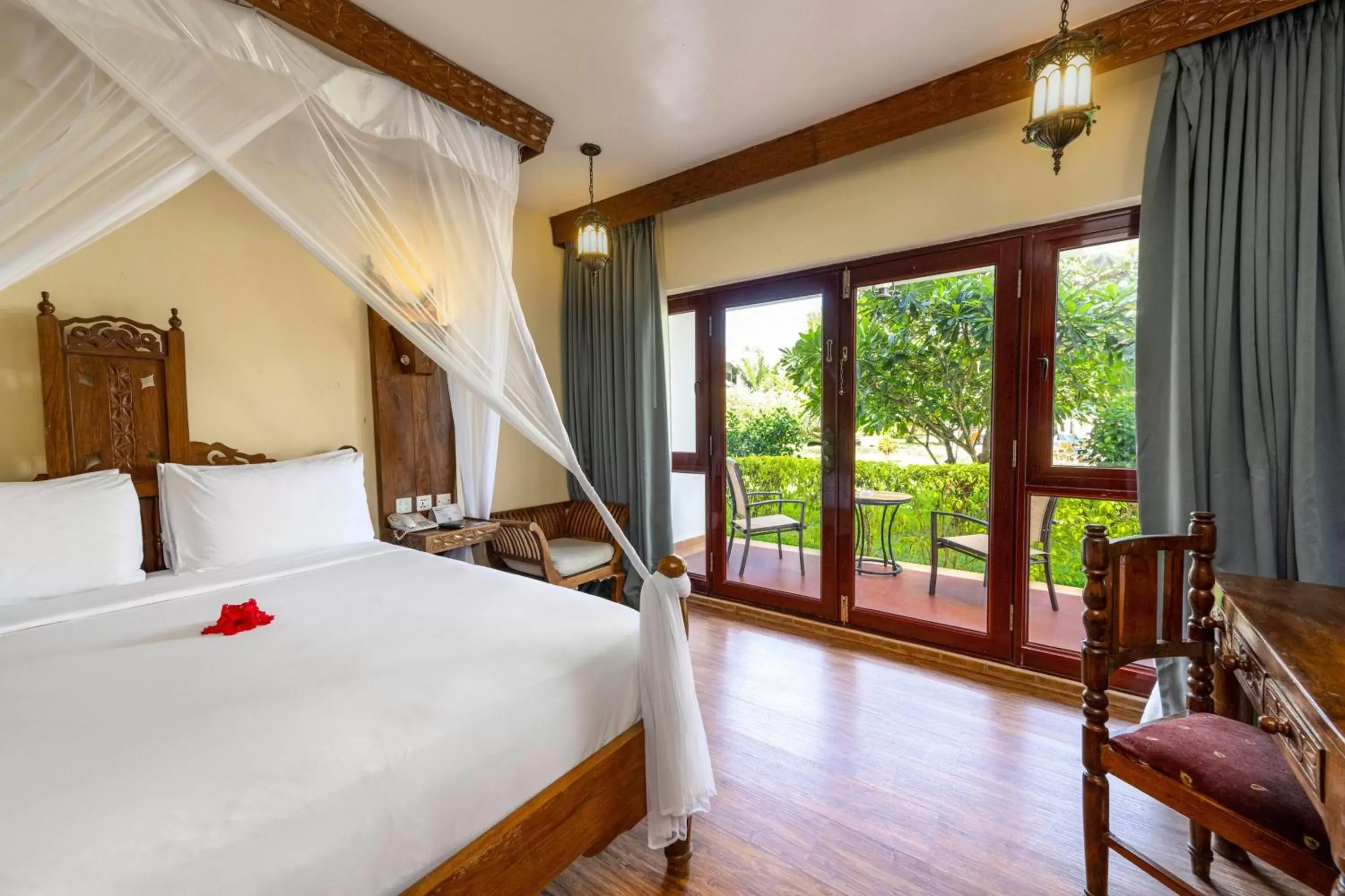 Photo of the whole room, Bed in Nungwi Beach Resort by Turaco