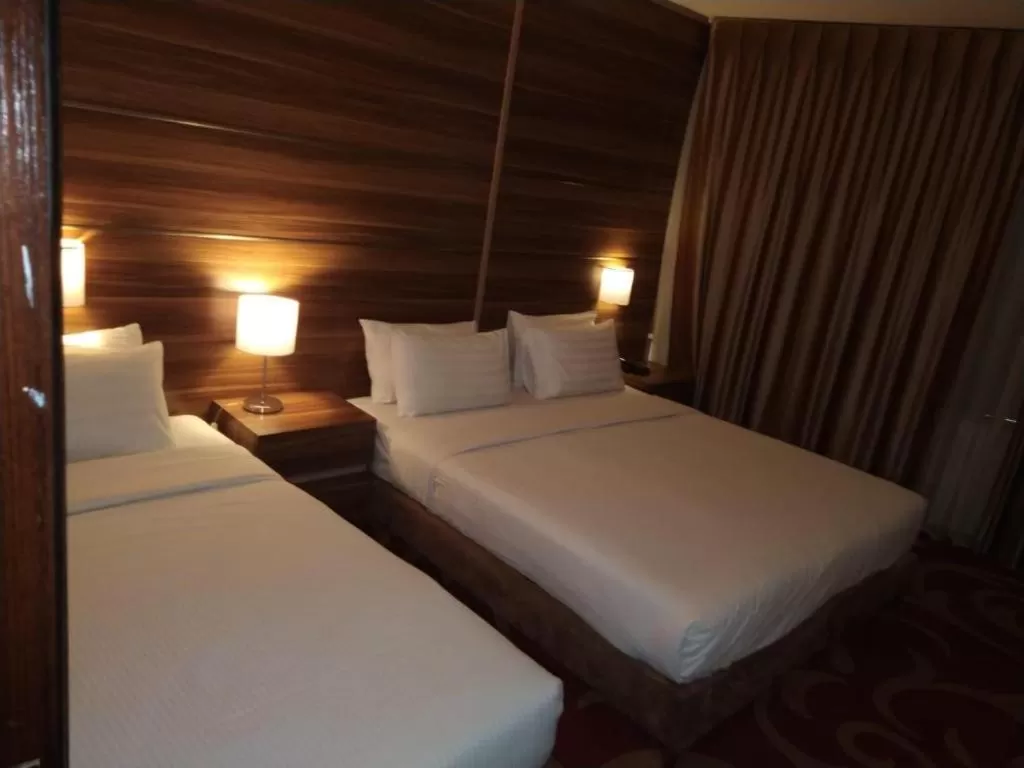 Bed in Spark Plaza Hotel