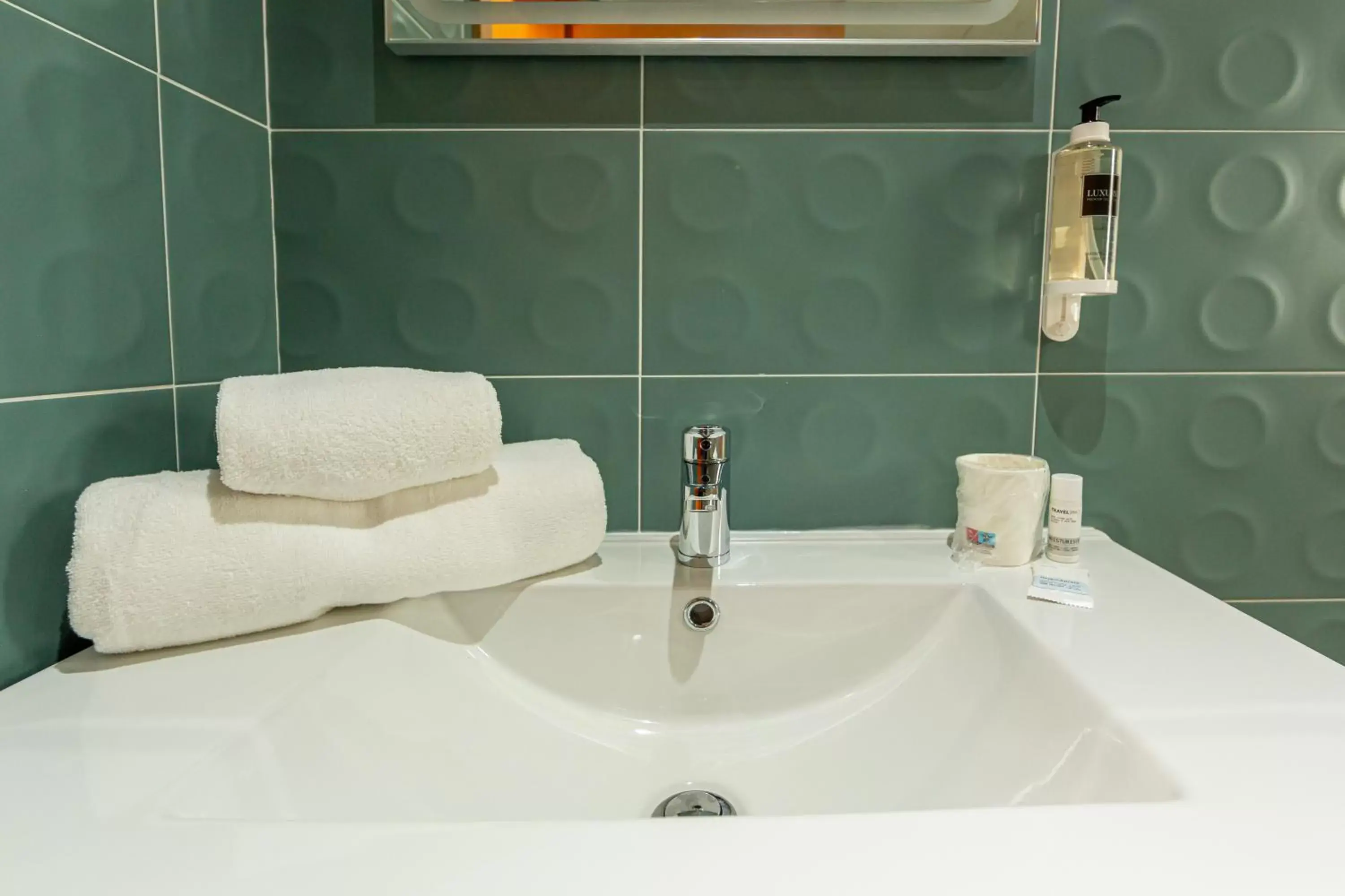 Bathroom in Luxury Palm Suites